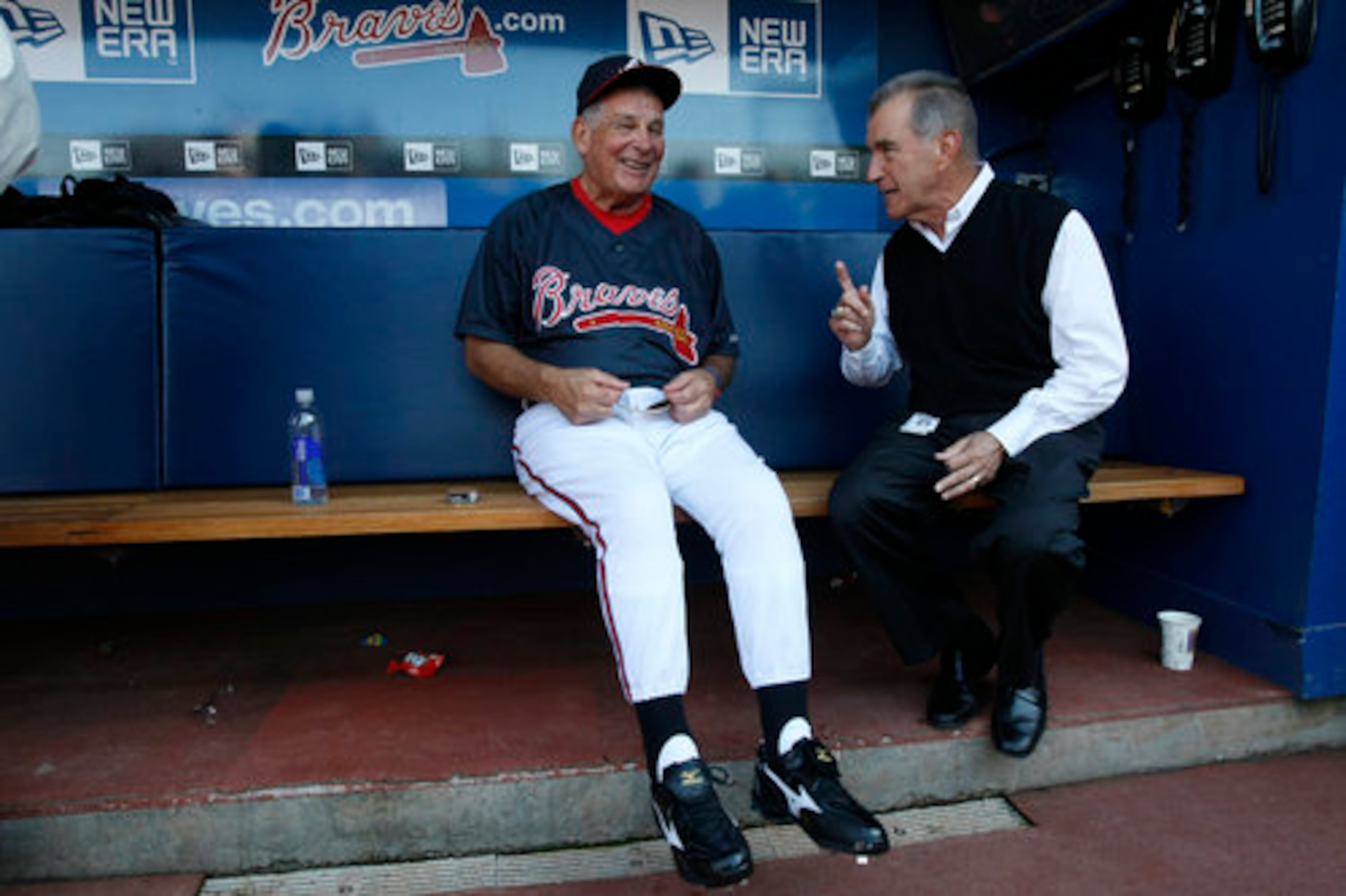 President of the Atlanta Braves John Schuerholz has Bobby Cox laughing in the dugout as they share a moment during batting practice before taking on the Phillies at Turner Field in Atlanta on Friday, Oct. 1, 2010.