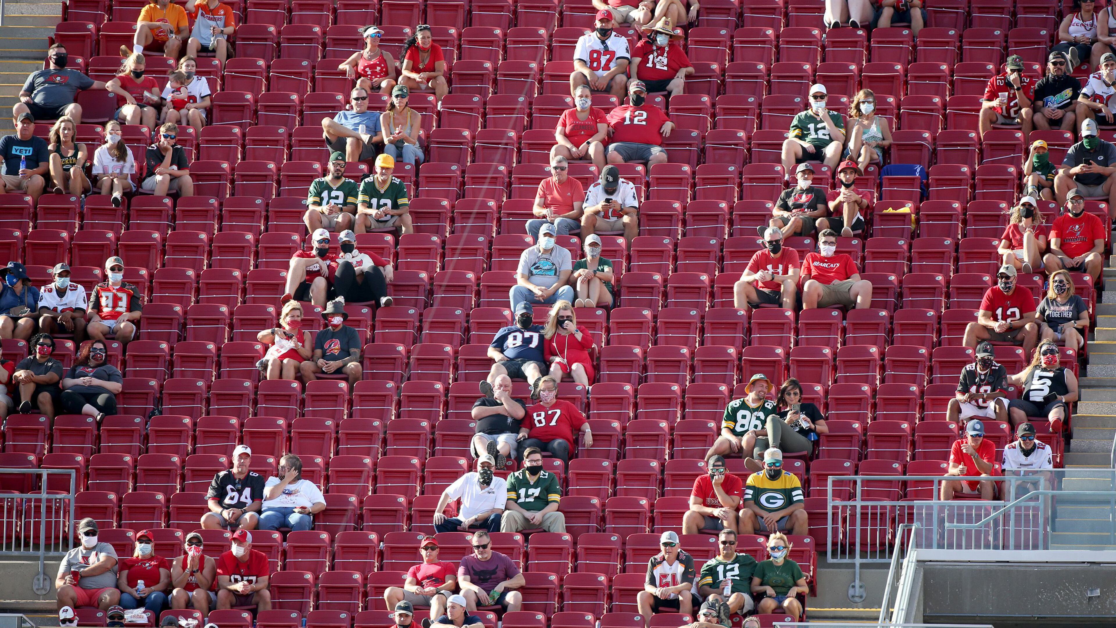 Fans are socially distanced in the 300 level during the first quarter of the game between the Green Bay Packers at Buccaneers and the Tampa Bay Buccaneers on Sunday, Oct. 18, 2020, at Raymond James Stadium in Tampa, Florida. (Douglas R. Clifford/Tampa Bay Times/TNS)