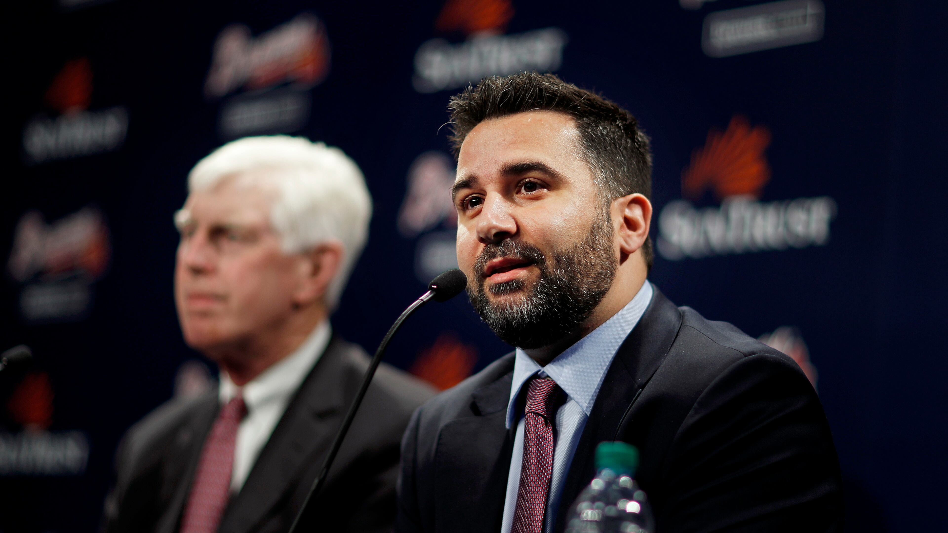 Alex Anthopoulos, right, speaks at a news conference introducing him as the new general manager of the Atlanta Braves baseball team by Terry McGuirk, left, chairman and CEO, in Atlanta, Monday, Nov. 13, 2017. (AP Photo/David Goldman)