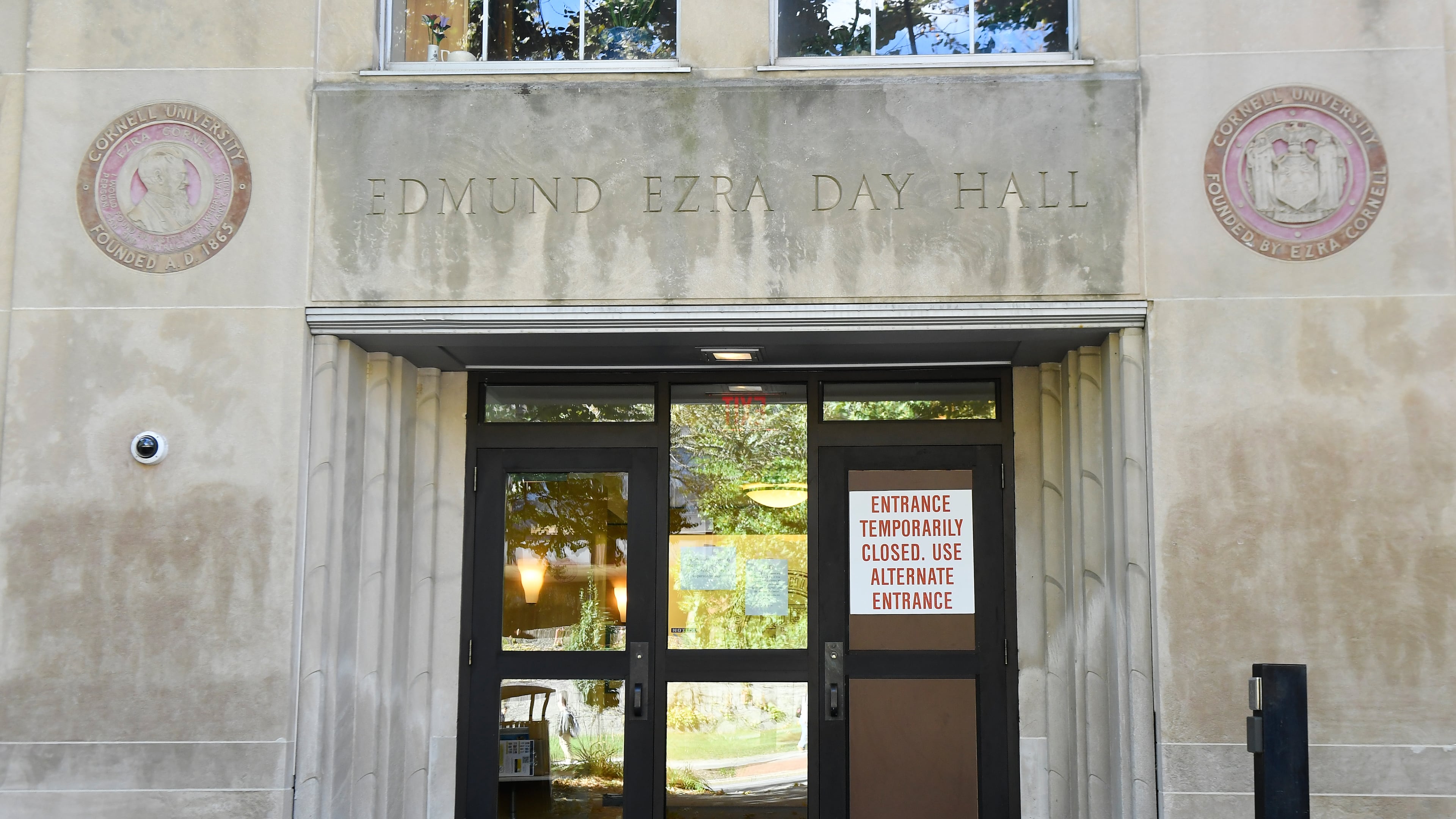 A sign is displayed on a door at Day Hall after damage and graffiti overnight was cleaned up at Cornell University, Monday, Oct. 5, 2026, in Ithaca, N.Y. (AP Photo/Adrian Kraus)