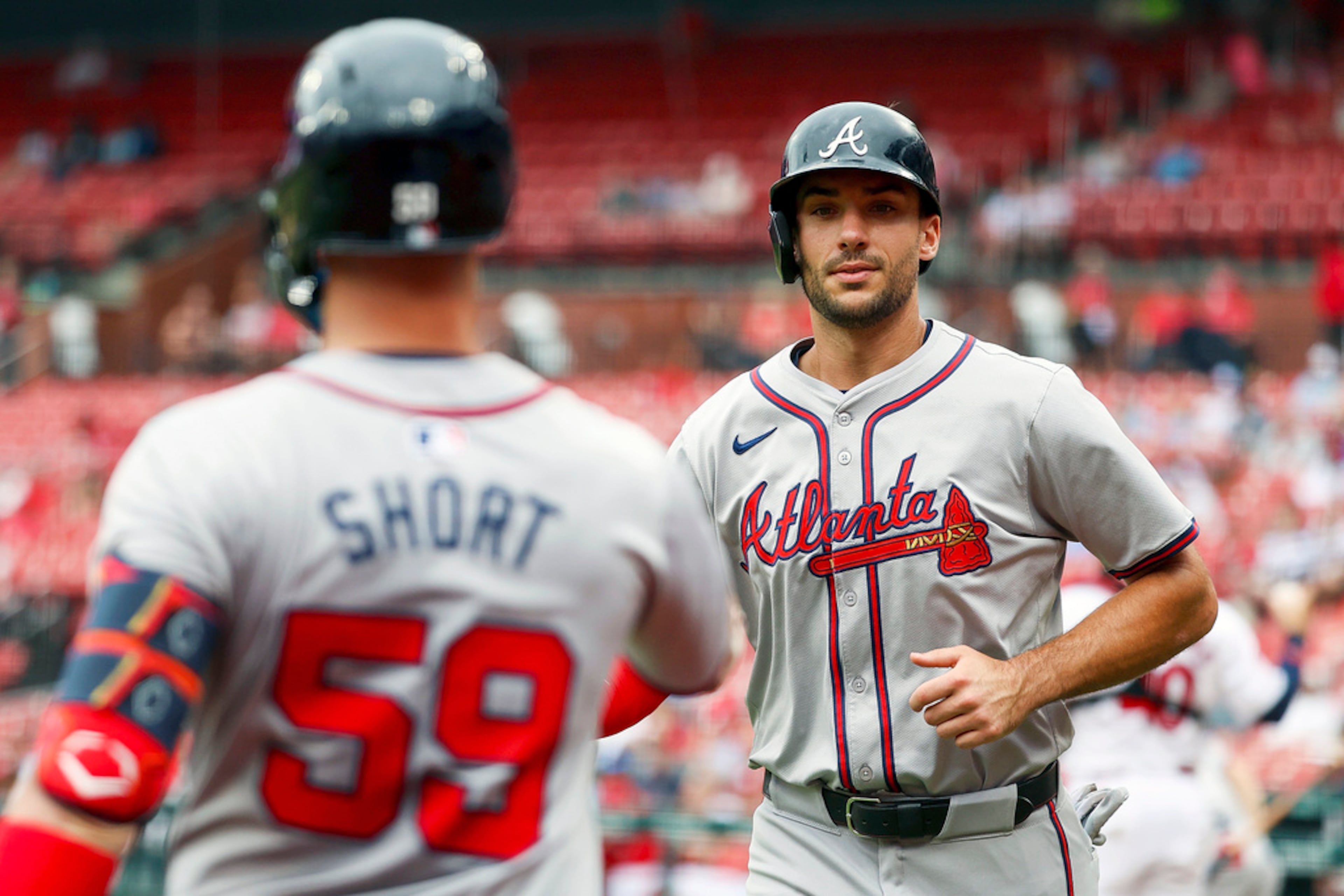Atlanta Braves' Matt Olson, right, is congratulated by Zack Short after scoring during the second inning in the first game of a baseball doubleheader against the St. Louis Cardinals Wednesday, June 26, 2024, in St. Louis. (AP Photo/Scott Kane)