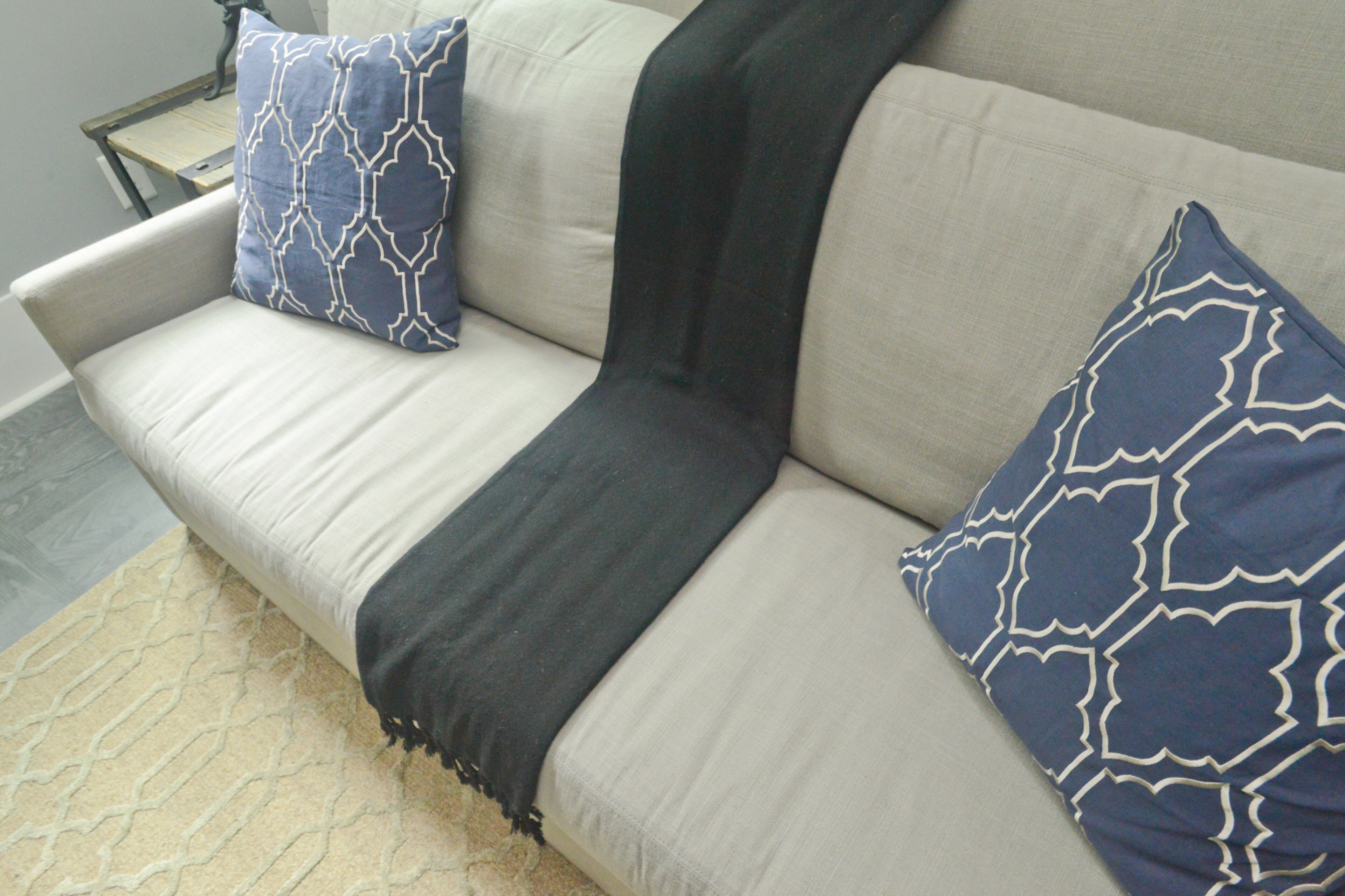 John and Lauren Kane's favorite piece of furniture in their new home in Serenbe is their living room sofa from Bungalow. They initially chose it because it fit the room, but the gray linen sofa turned out to be one of the most comfortable pieces of furniture in the house. From there, they have a view of the entire first floor and out into the back garden. "It's a nice place to have a nice moment," Lauren said.