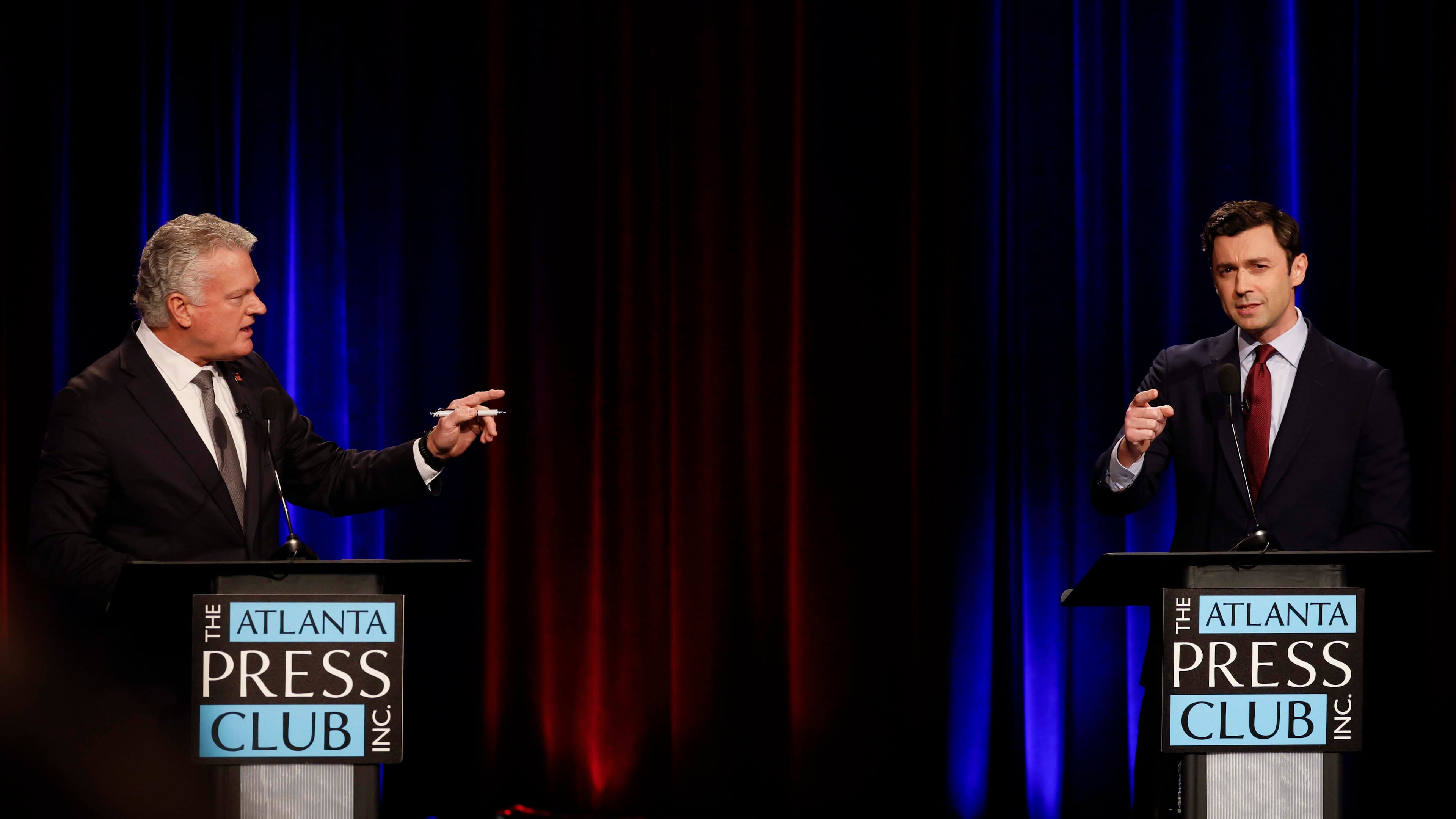 Republican U.S. Rep. Mike Collins, left, debates incumbent Democratic U.S. Sen. Jon Ossoff during the Atlanta Press Club Loudermilk-Young Debate Series on Tuesday. (Miguel Martinez/AJC)