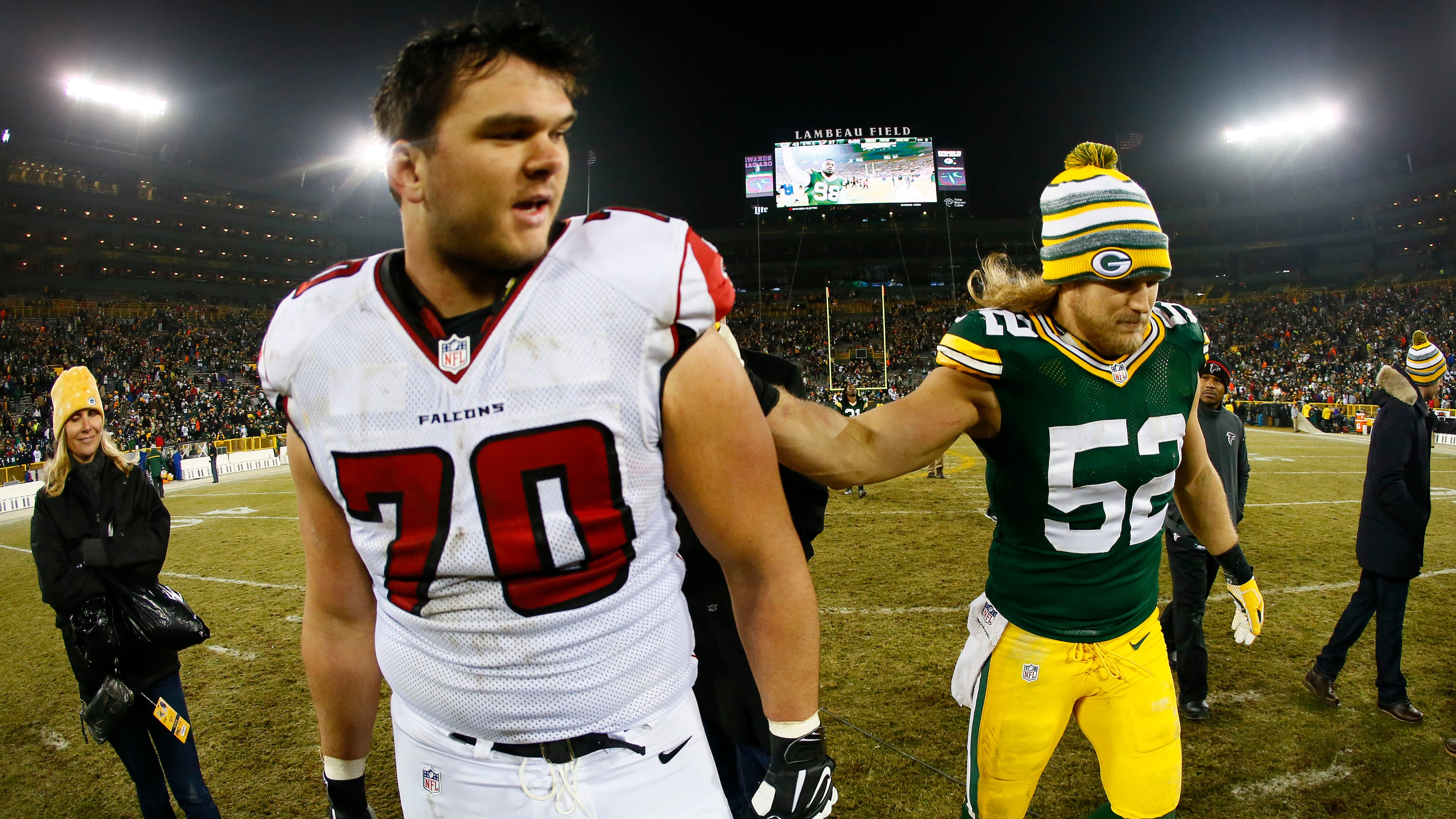 GREEN BAY, WI - DECEMBER 08: Clay Matthews #52 of the Green Bay Packers and Jake Matthews #70 of the Atlanta Falcons leave the field after the Packers defeated the Falcons 43 to 37 at Lambeau Field on December 8, 2014 in Green Bay, Wisconsin. (Photo by Kevin C. Cox/Getty Images)