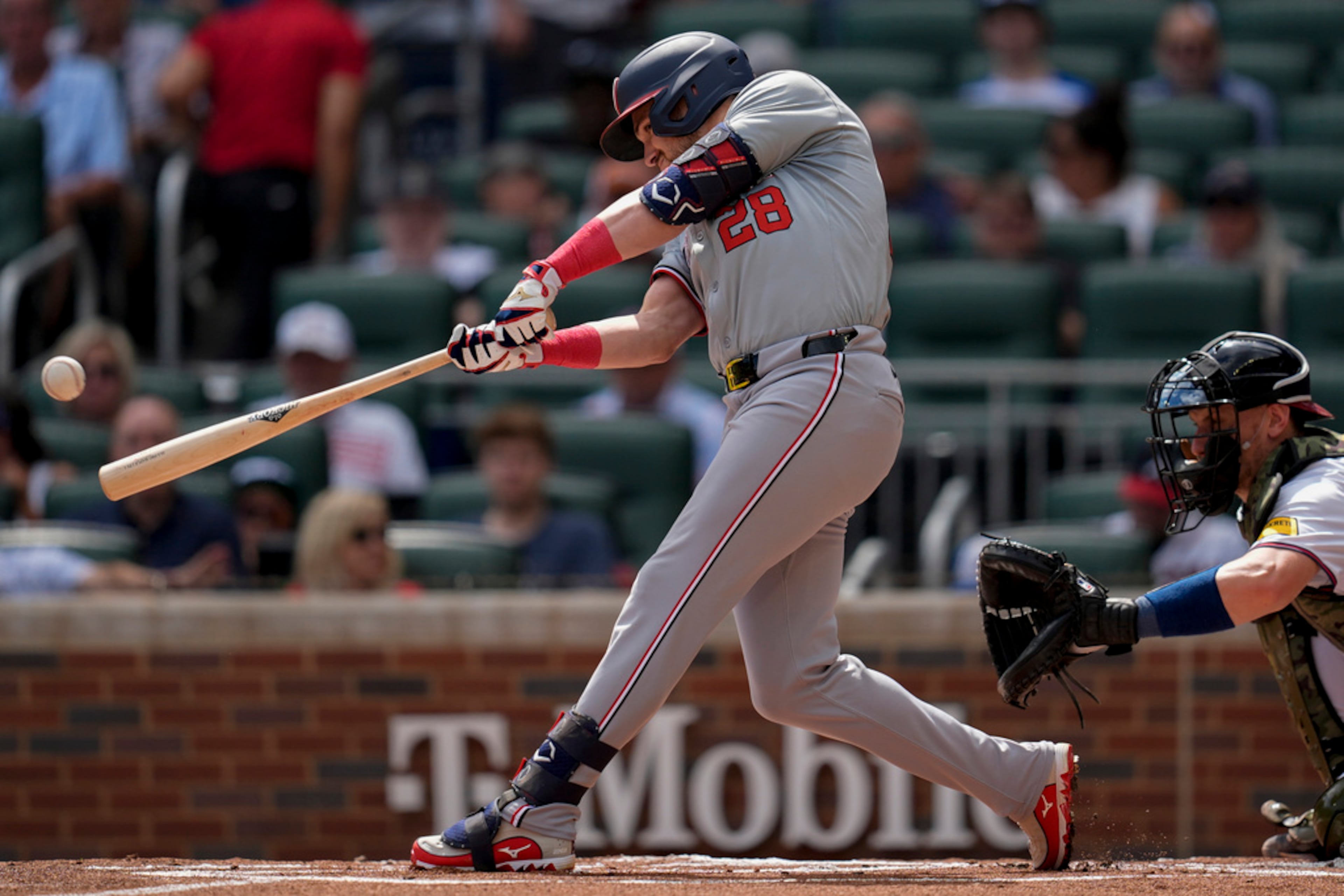 Washington Nationals' Lane Thomas hits a double in the first inning of a baseball game against the Atlanta Braves, Monday, May 27, 2024, in Atlanta. (AP Photo/Mike Stewart)