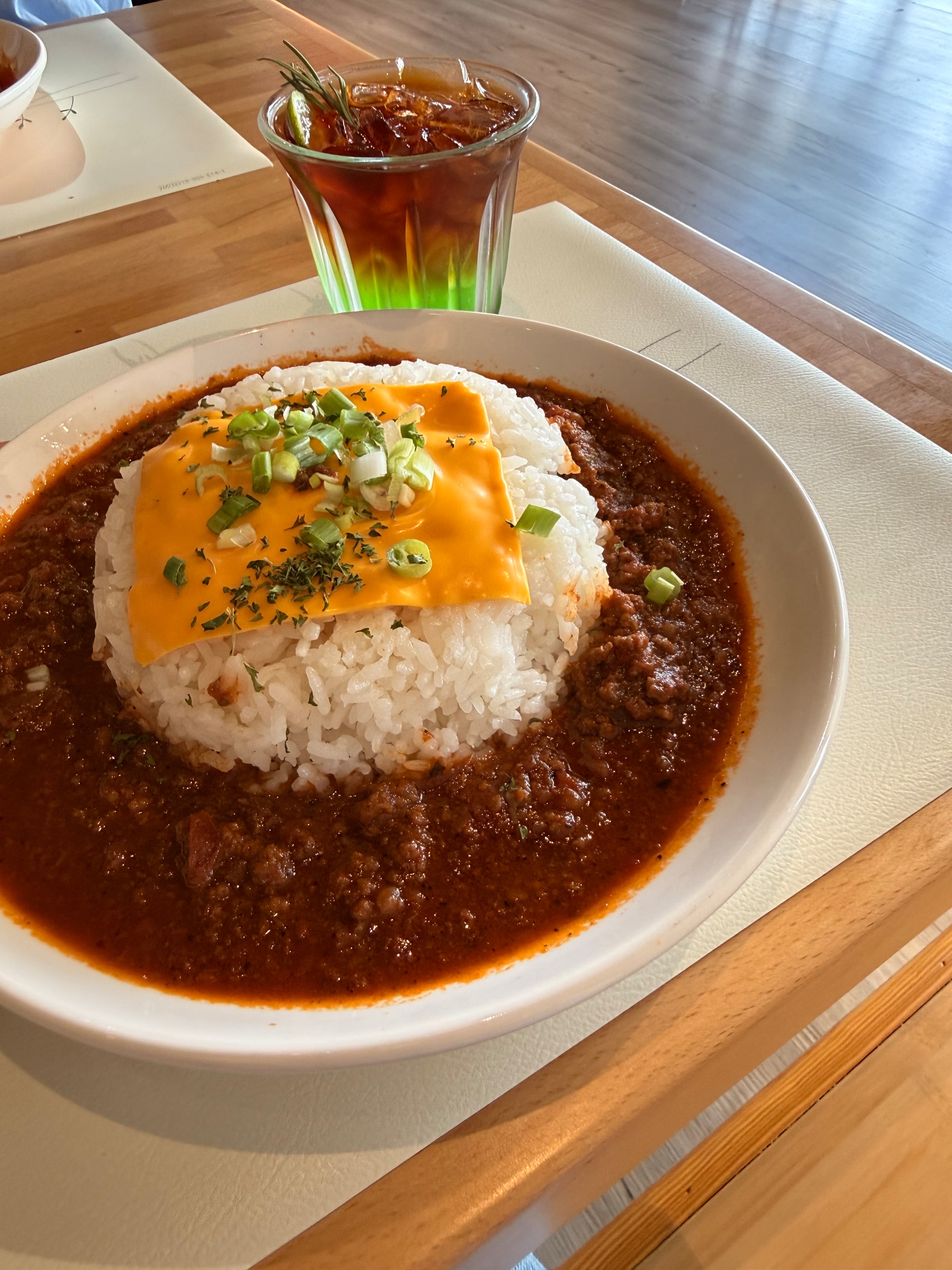 Tomato cheese braised beef with a green apple cold brew drink at ScentTok Craft Cafe. (Justin Brown for the AJC)