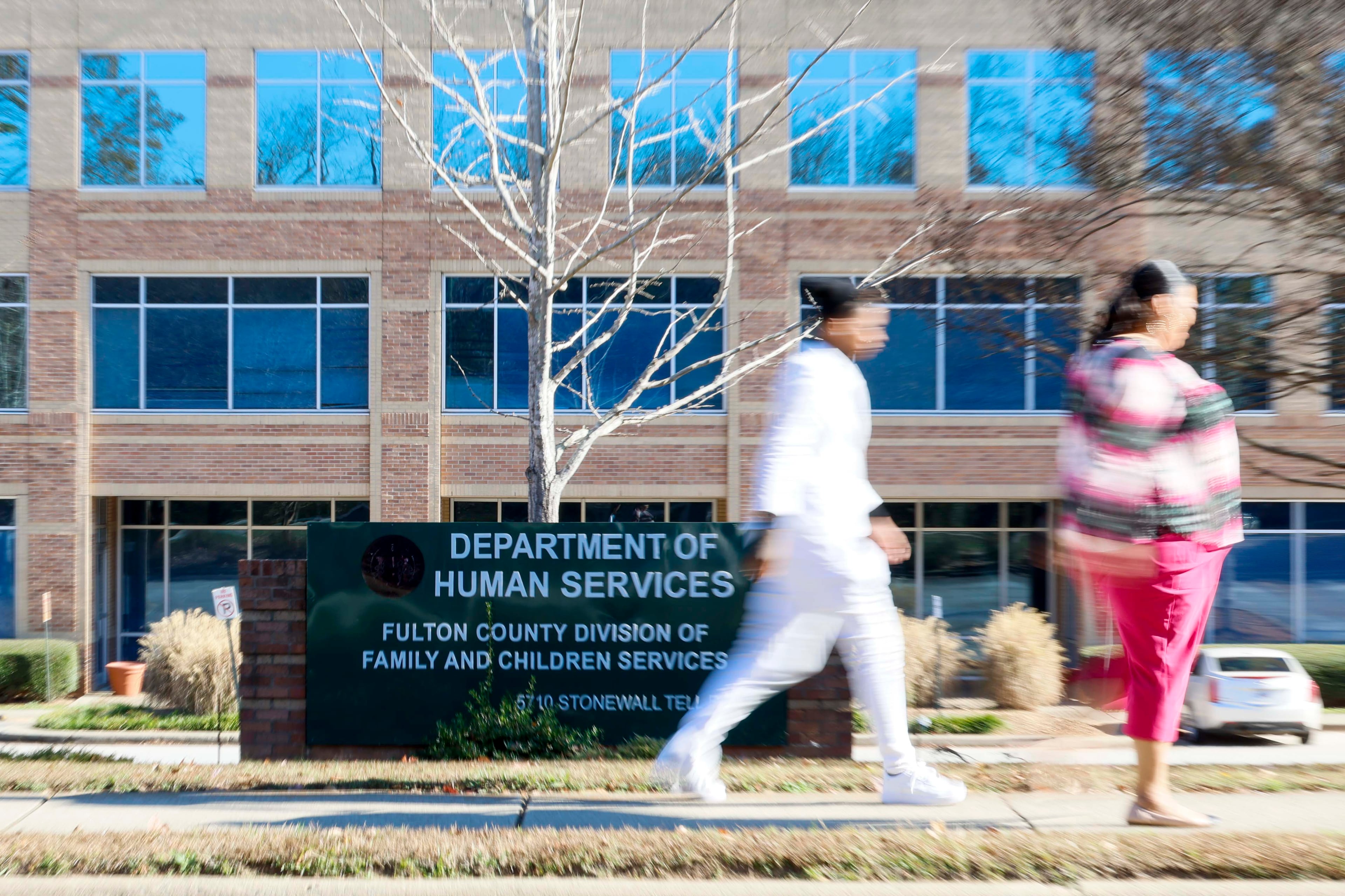 Pedestrians walk past the Department of Human Services, Division of Family & Children Services building in South Fulton, on Sunday, Nov 23, 2025. (Miguel Martinez/ AJC)