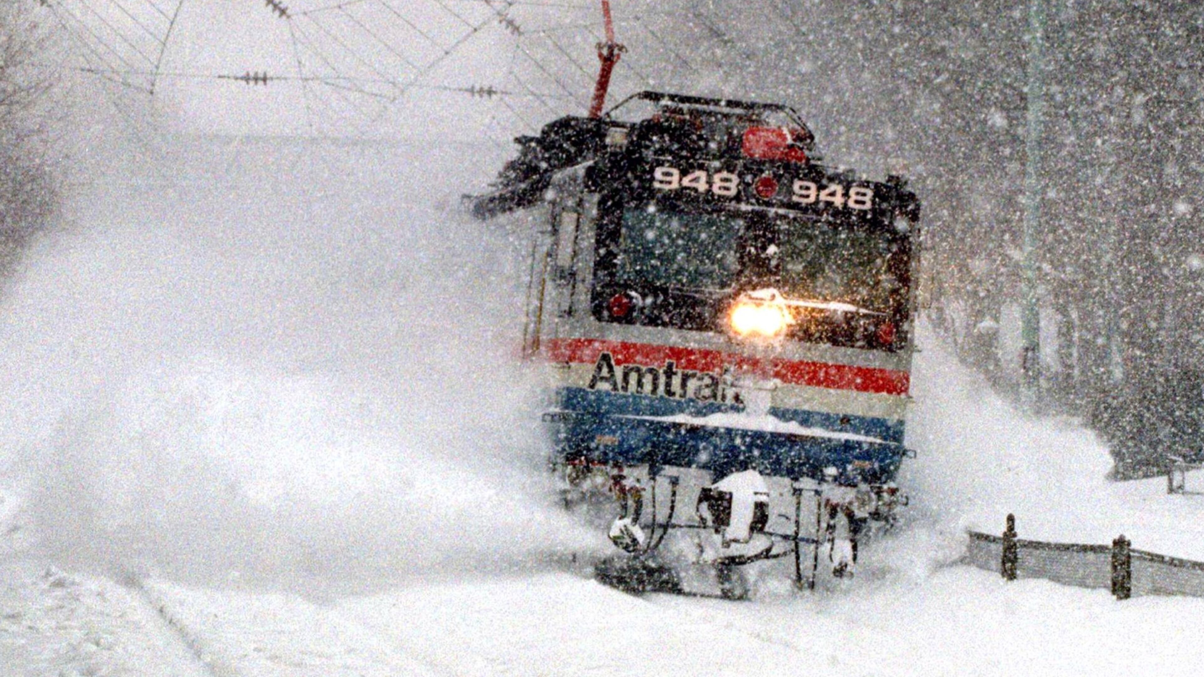 UNITED STATES - JANUARY 12: An Amtrak train blasts through a snow drift, as it runs through Wynnewood, Pa., en route from Harrisburg to Philadelphia. (Photo by Harry Hamburg/NY Daily News Archive via Getty Images)