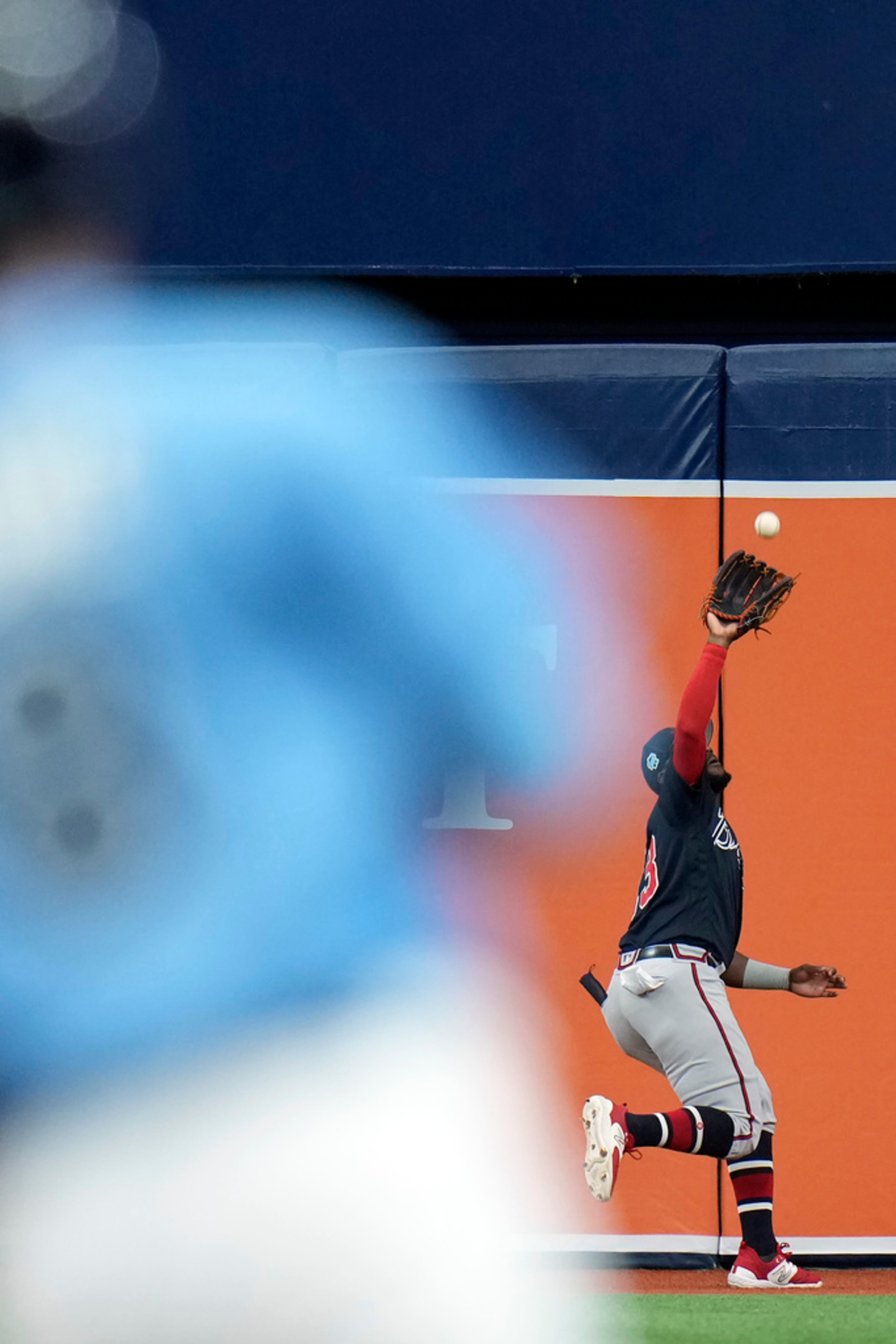 Atlanta Braves center fielder Michael Harris II, right, makes the catch on a flout by Tampa Bay Rays' Brandon Lowe during the first inning of a spring training baseball game Friday, March 10, 2023, in St. Petersburg, Fla. (AP Photo/Chris O'Meara)