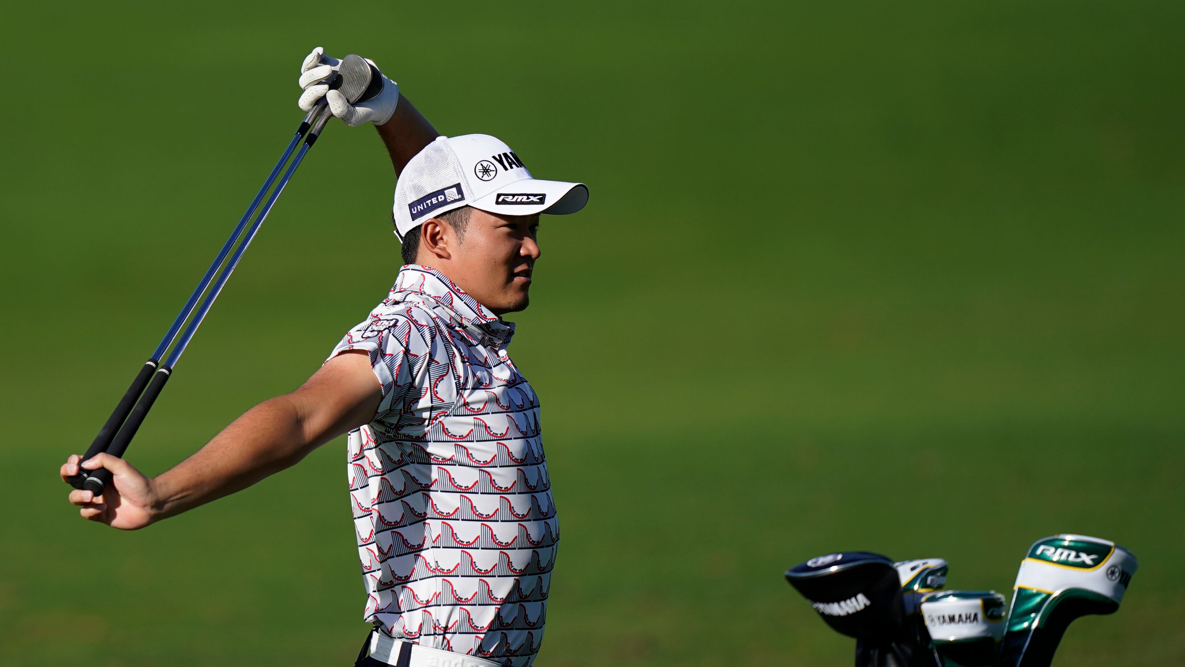 Shugo Imahira stretches on the driving range during a practice round for the Masters Tournament Monday, Nov. 9, 2020, in Augusta, Ga. (David J. Phillip/AP)