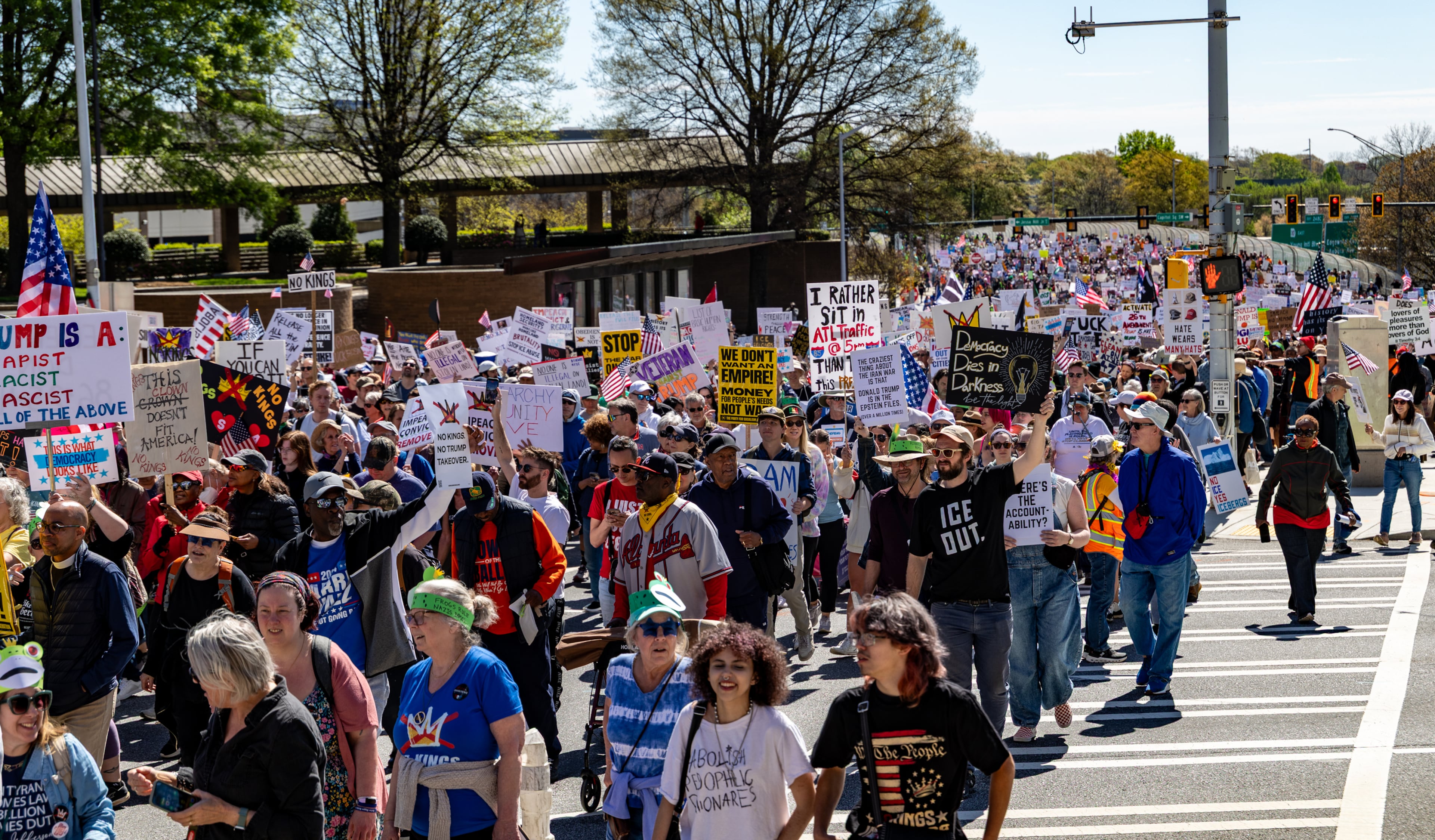 Demonstrators march toward the state Capitol during the No Kings protest on Saturday, March 28, 2026, in Atlanta. (Jenni Girtman for the AJC)