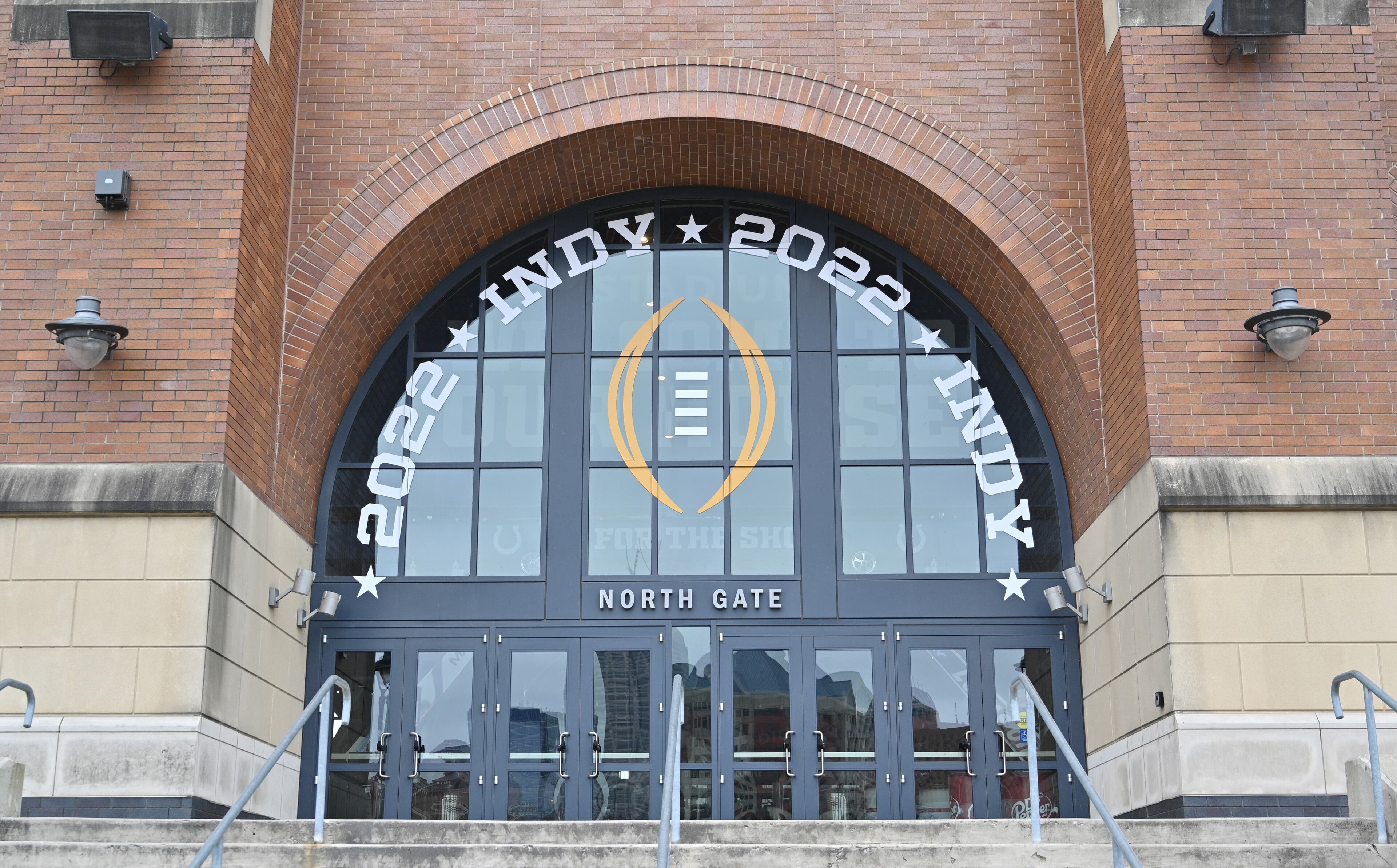 January 6, 2022 Indianapolis, IN - Signages are displayed outside Lucas Oil Stadium as workers are getting ready for the 2022 College Football Playoff National Championship game between Georgia and Alabama. (Hyosub Shin / Hyosub.Shin@ajc.com)