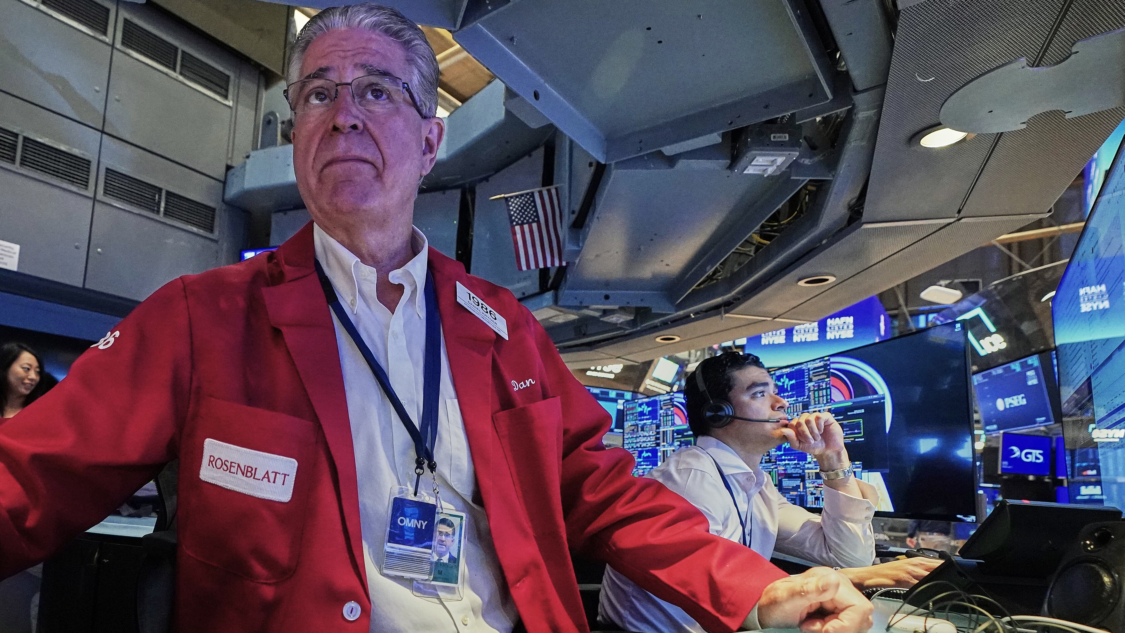 Trader Daniel Kryger, left, works on the floor of the New York Stock Exchange, Monday, June 15, 2026. (AP Photo/Richard Drew)