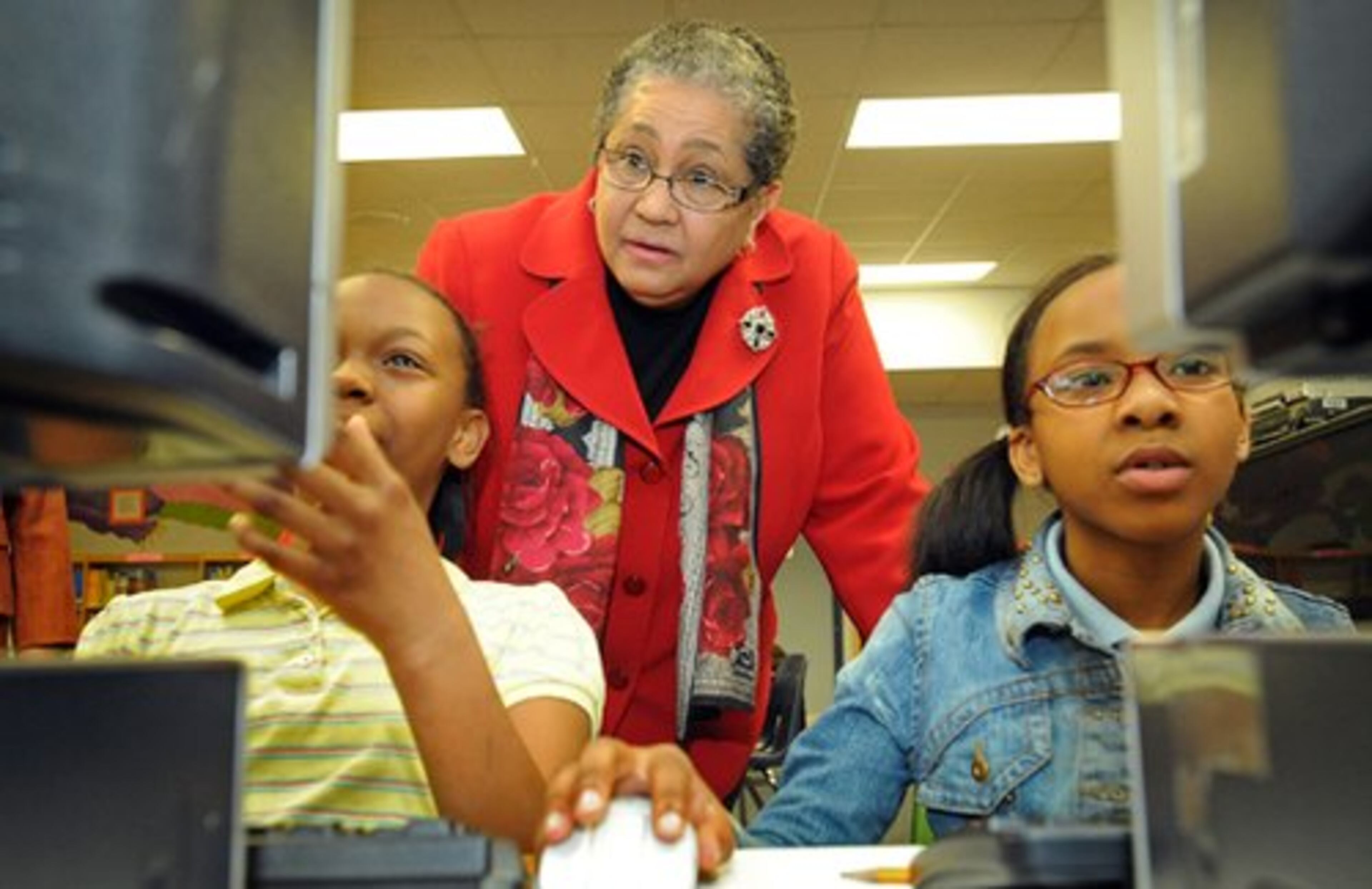 Atlanta schools Superintendent Beverly Hall (center) talks with Endya Boyd (left) and Rodneisha Ooten as Hall visits Beecher Hills Elementary. Hall was selected superintendent of the year.