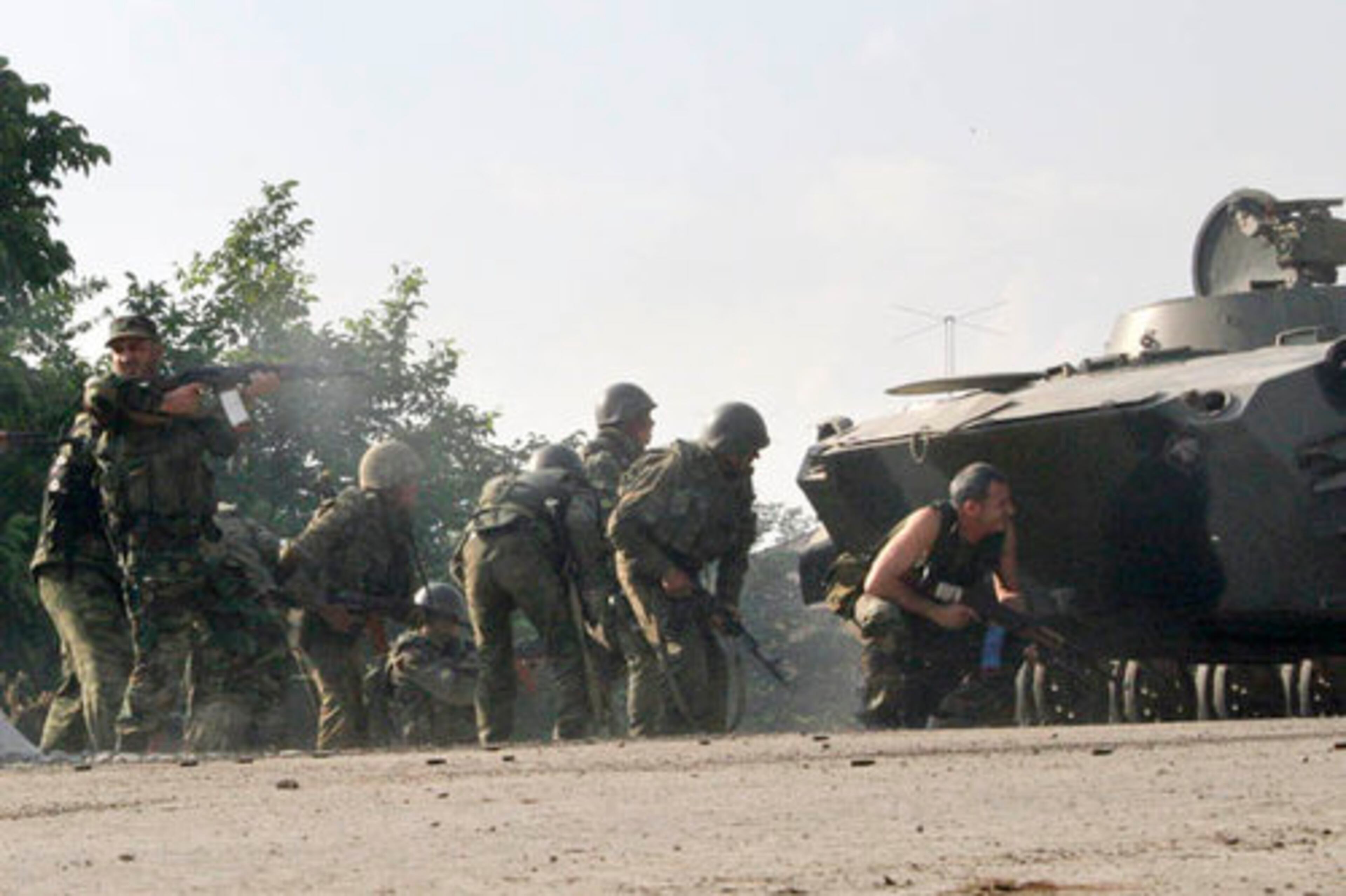 Ossetian soldiers are seen in action at the outskirts of the village of Achabet.