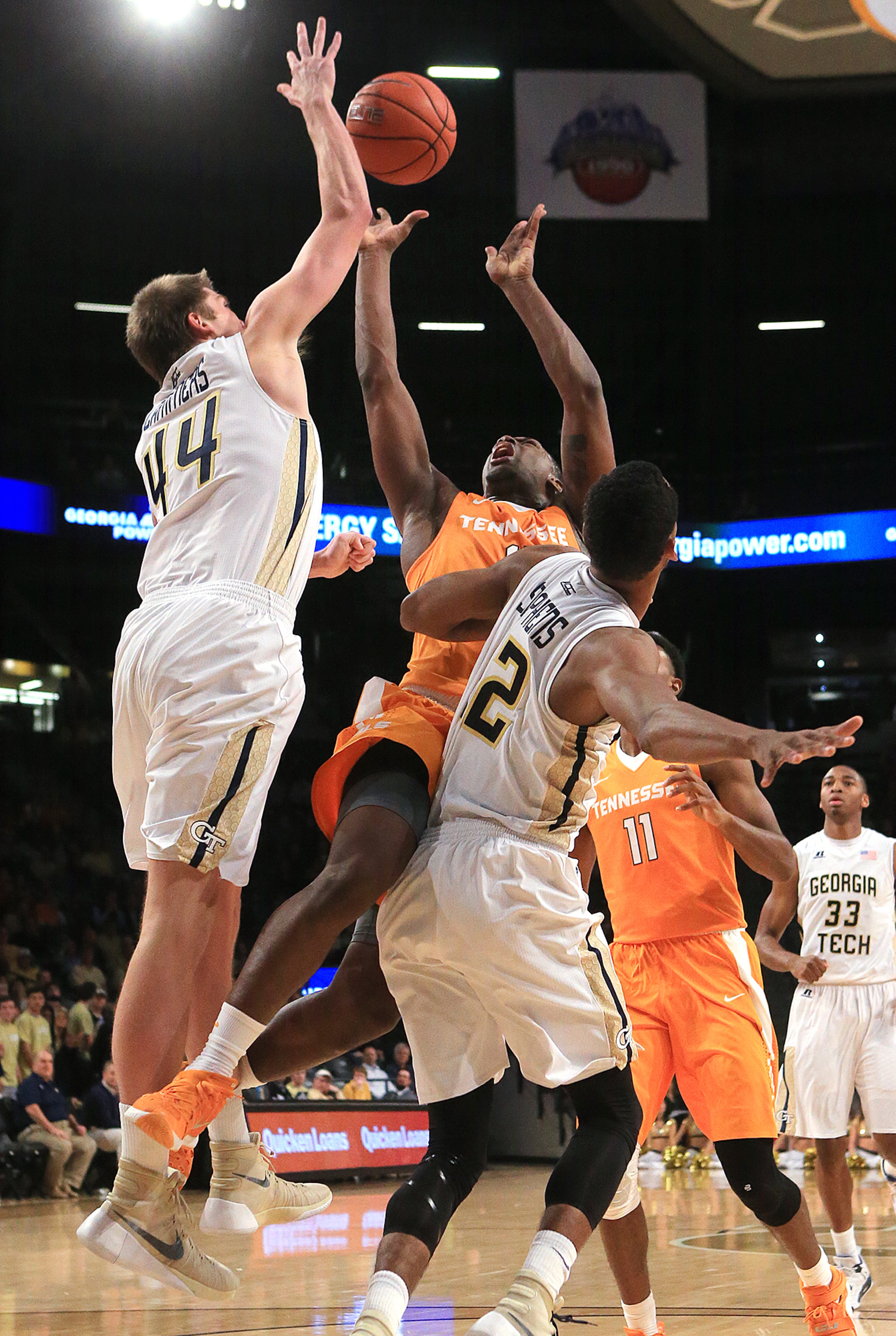 Georgia Tech defender Ben Lammers (left) blocks a shot by Tennessee forward Armani Moore with some help from Adam Smith during the first half in a basketball game on Monday, Nov. 16, 2015 in Atlanta. Curtis Compton / ccompton@ajc.com