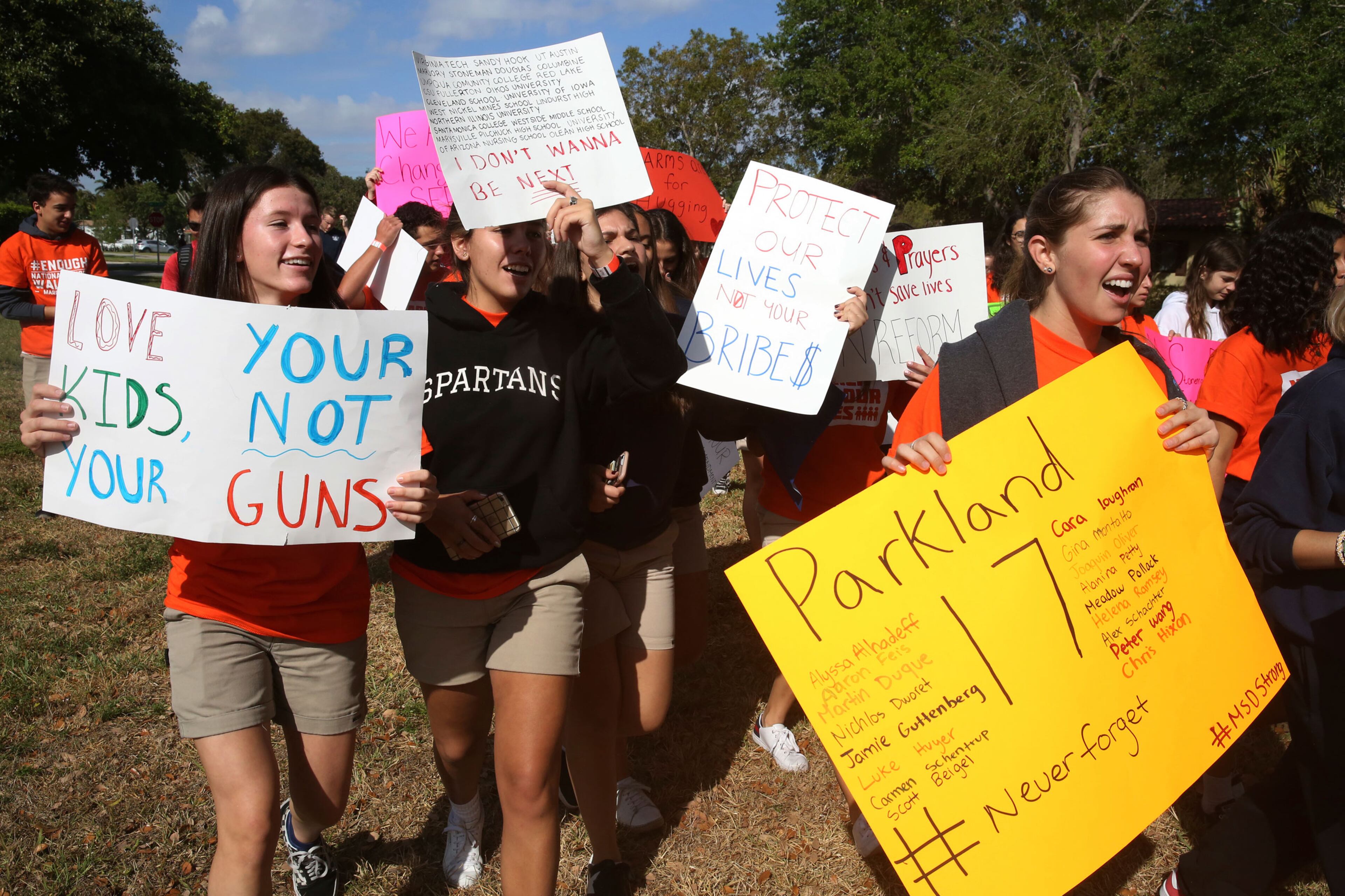 Students from Miami County Day School walk out of their school to protest gun violence in Miami Shores, Fla., Wednesday, March 14, 2018. Students from all over the country rallied to continue to put pressure on state and federal lawmakers to enact gun control and school safety legislation. The day marks one month since a gunman killed 17 students and faculty at Marjory Stoneman Douglas High School in Parkland, Fla.