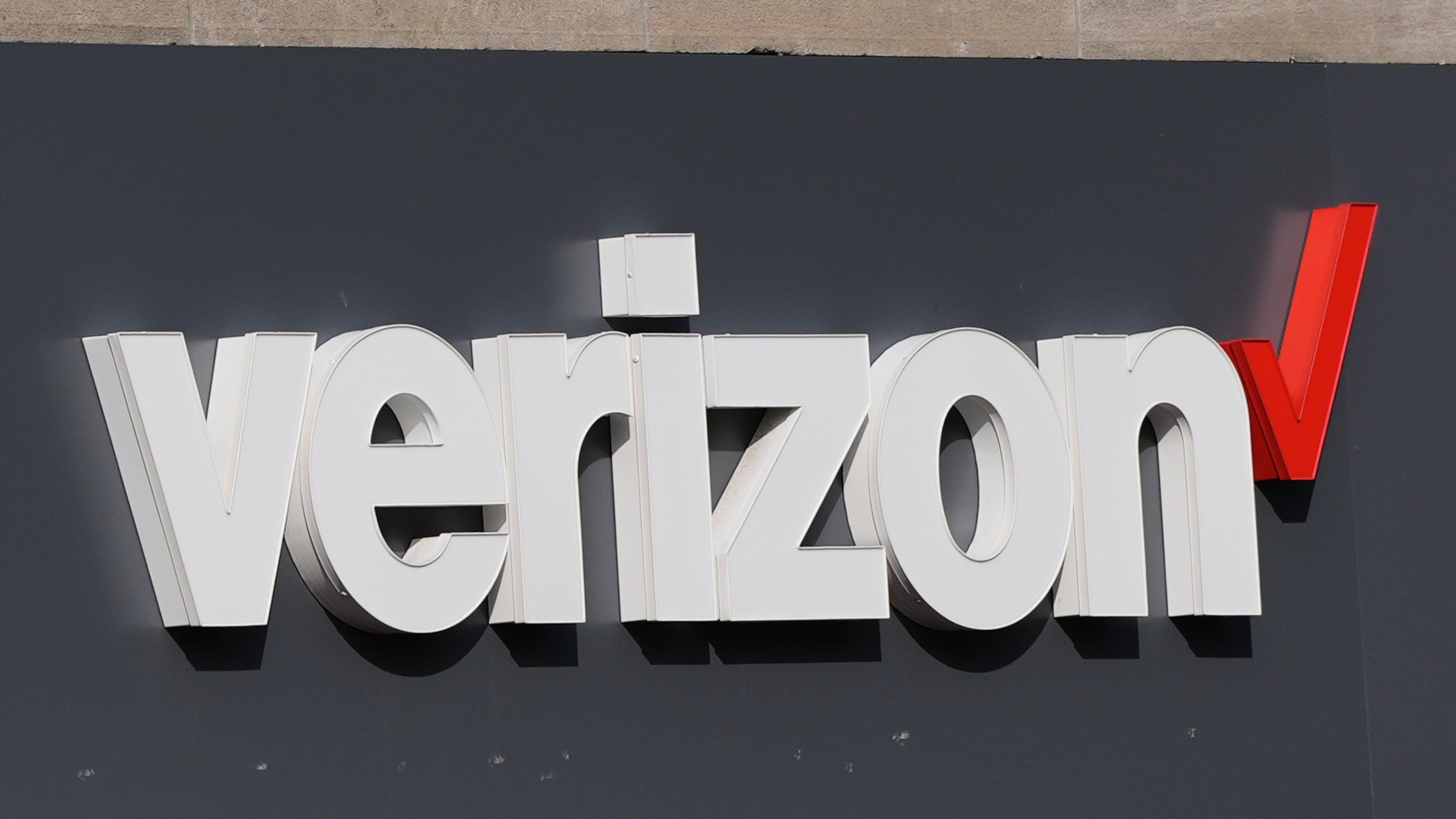 FILE - A Verizon sign is displayed on a store, Sept. 30, 2025, in Cambridge, Mass. (AP Photo/Charles Krupa, File)
