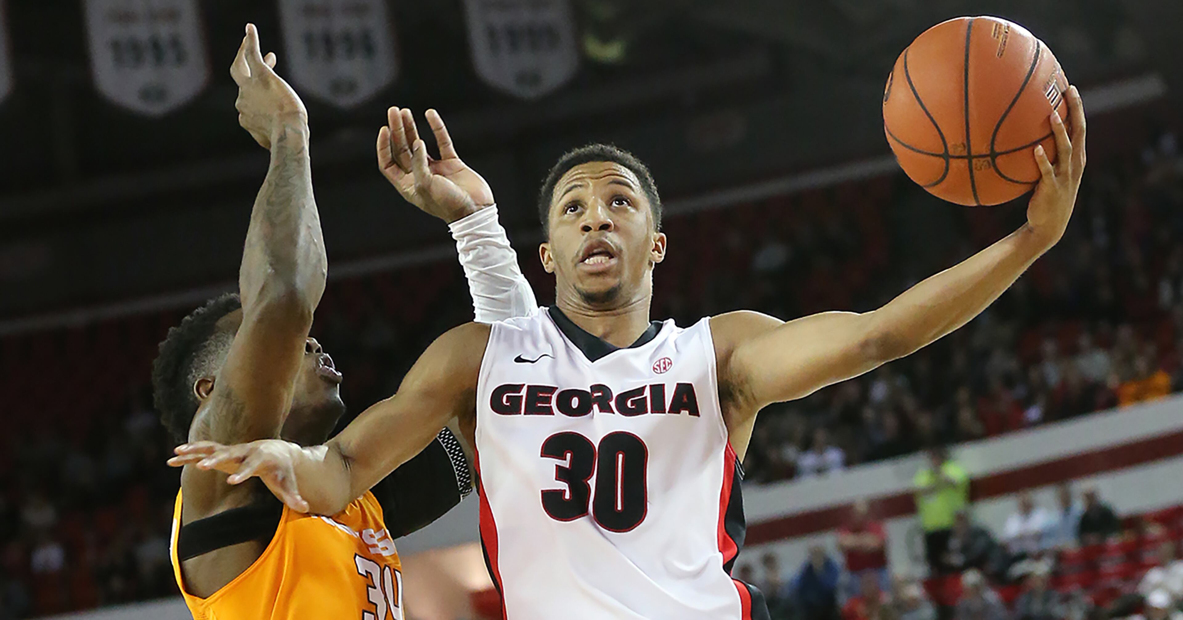 Georgia guard J.J. Frazier drives past Tennessee defender Devon Baulkman for two of his team high 28-points in a basketball game on Wednesday, Jan. 13, 2016, in Athens. Georgia beat Tennessee 81-72. Curtis Compton / ccompton@ajc.com
