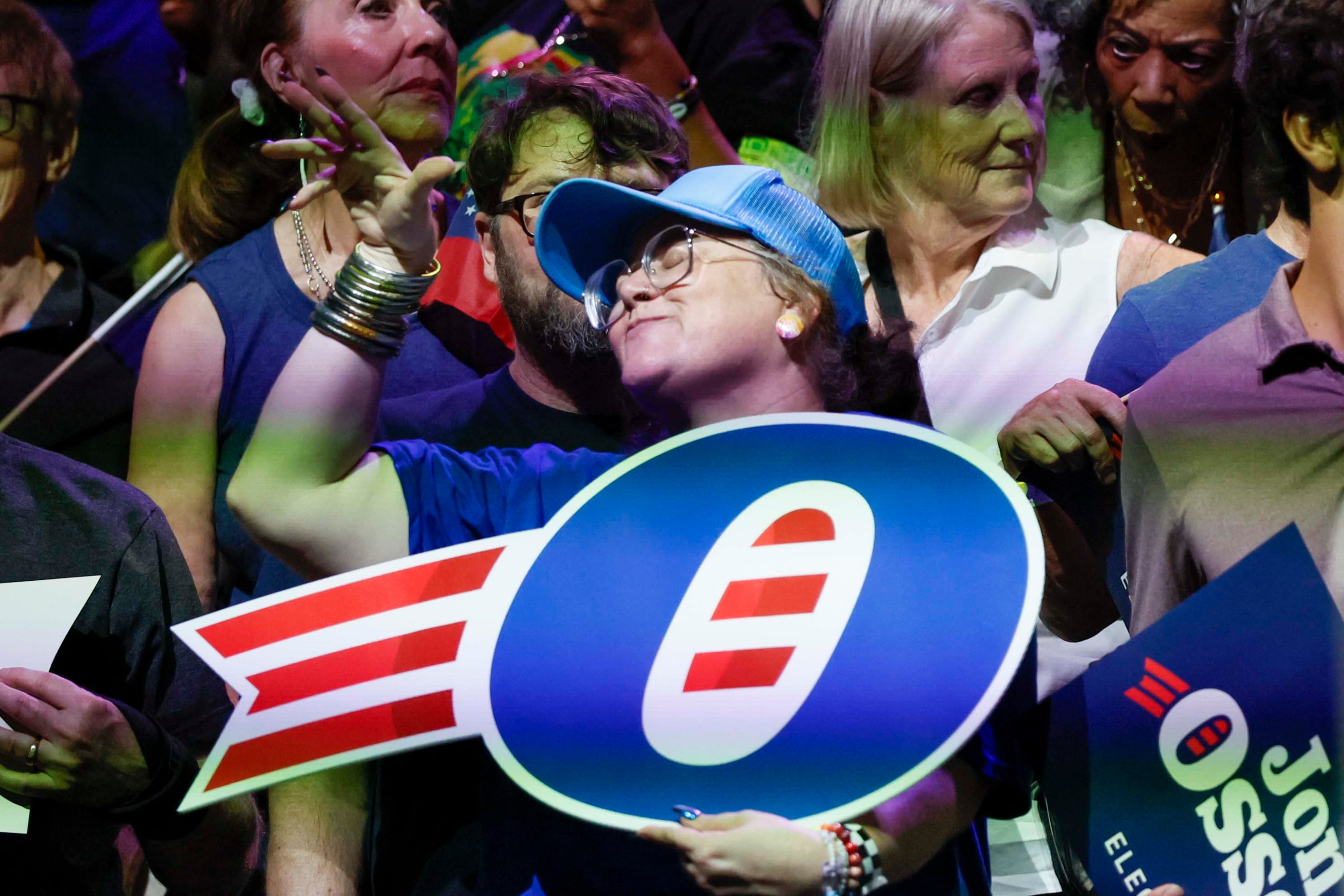 A supporter of U.S. Sen. Jon Ossoff reacts on stage, dancing to the DJ’s music, ahead of the campaign rally at the Center Stage Theater on Sunday, August 16, 2026.
(Miguel Martinez/AJC)