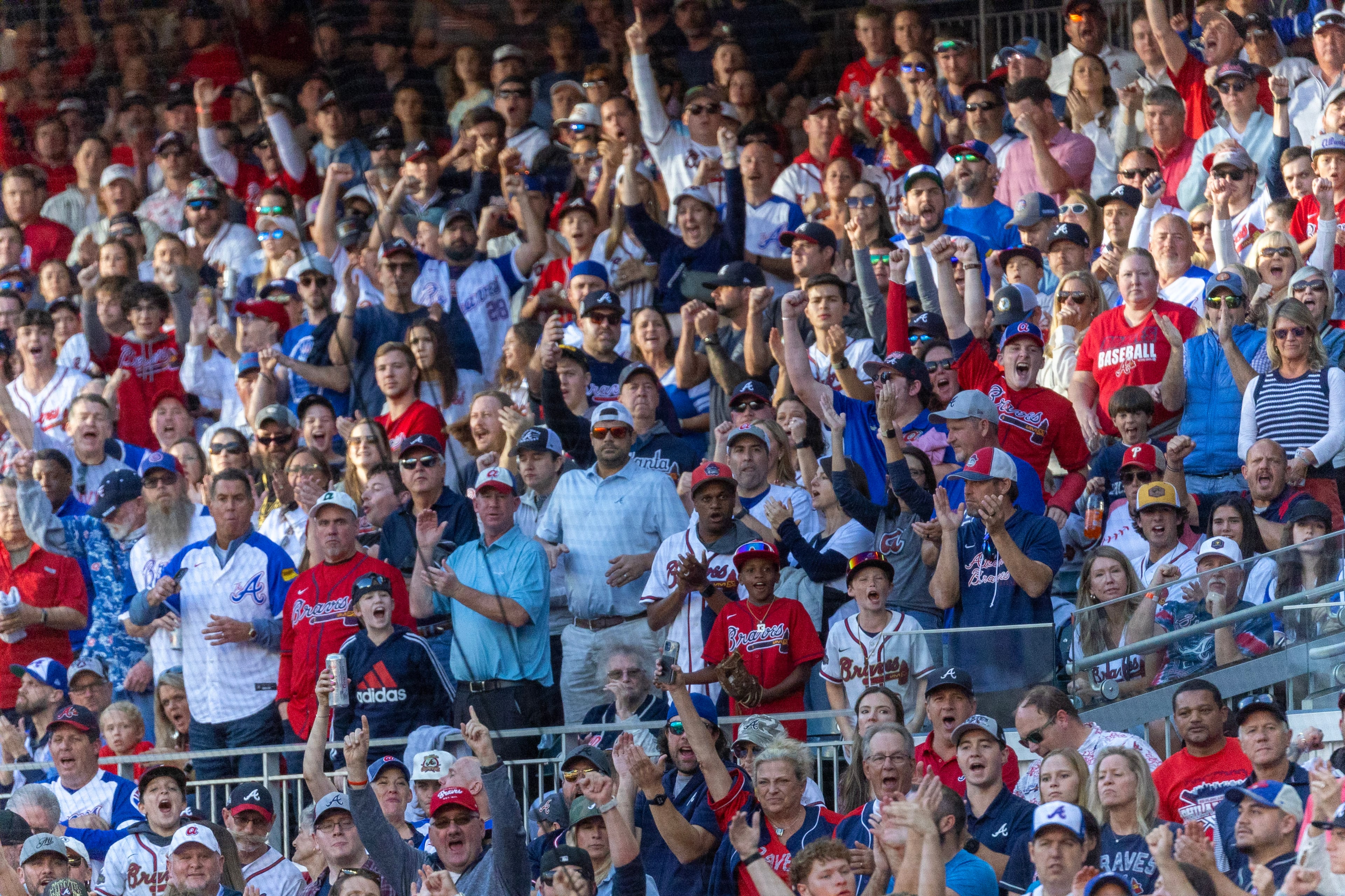 Fans cheer during the first inning of the NLDS Game 2 in Atlanta on Monday, Oct. 9, 2023. (Miguel Martinez / Miguel.Martinezjimenez@ajc.com)