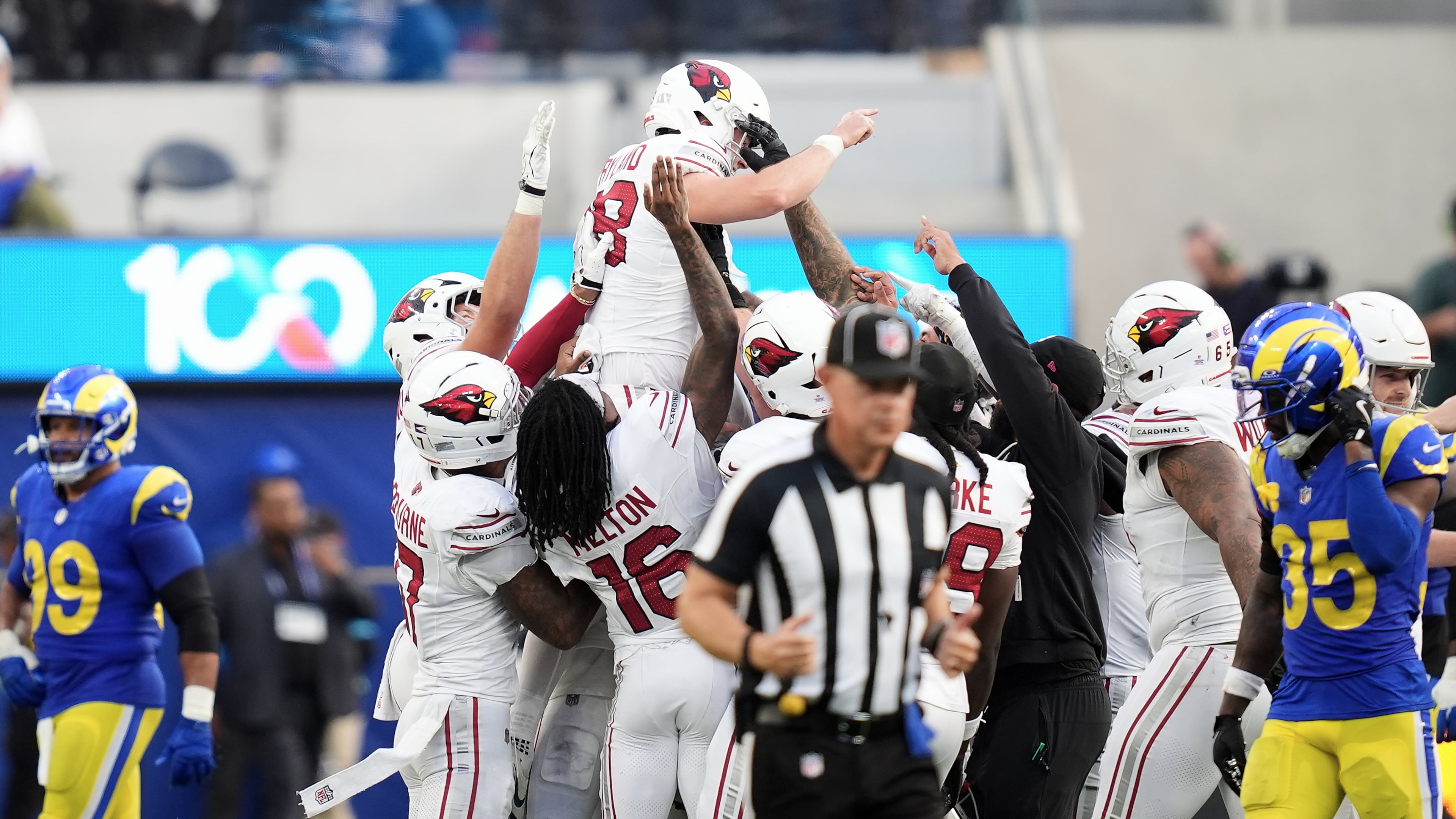 Arizona Cardinals kicker Chad Ryland, top, is congratulated by teammates after kicking the game winning field goal against the Los Angeles Rams during the second half of an NFL football game in Inglewood, Calif., Sunday, Oct. 18, 2026. (AP Photo/Gregory Bull)