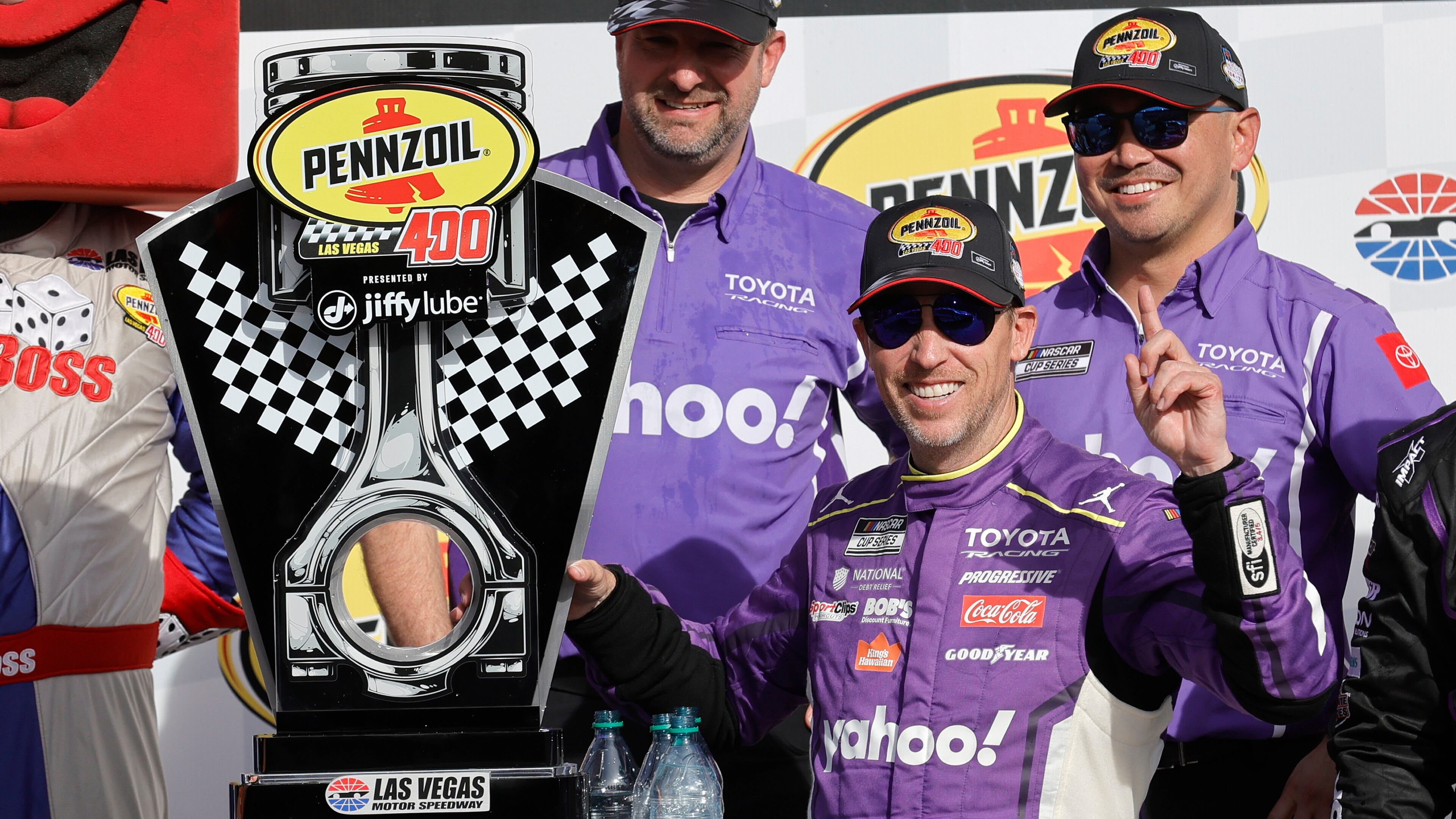 Denny Hamlin poses with his trophy in Victory Lane after winning a NASCAR Cup Series auto race at, Sunday, March 15, 2026, in Las Vegas. (AP Photo/Steve Marcus)