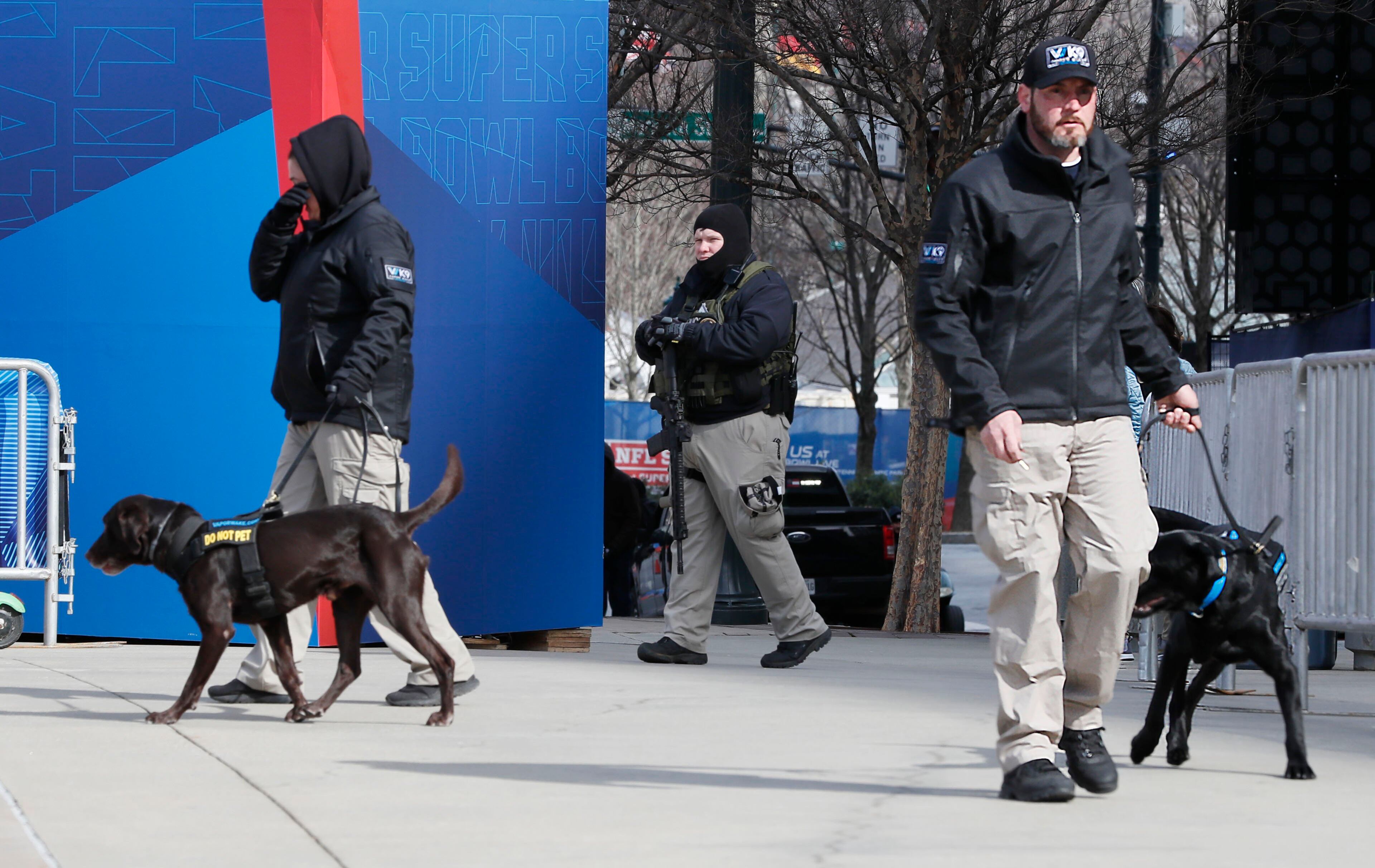 1/30/19 - Atlanta - Vapor Wake Weapons Detection Canines, trained for mass pedestrian weapons detection and explosives screening, are on hand to scan pedestrians at the entrance to the GWCC. Security around the Georgia World Congress Center and Mercedes-Benz Stadium includes multiple layers with personnel from multiple agencies Bob Andres / bandres@ajc.com