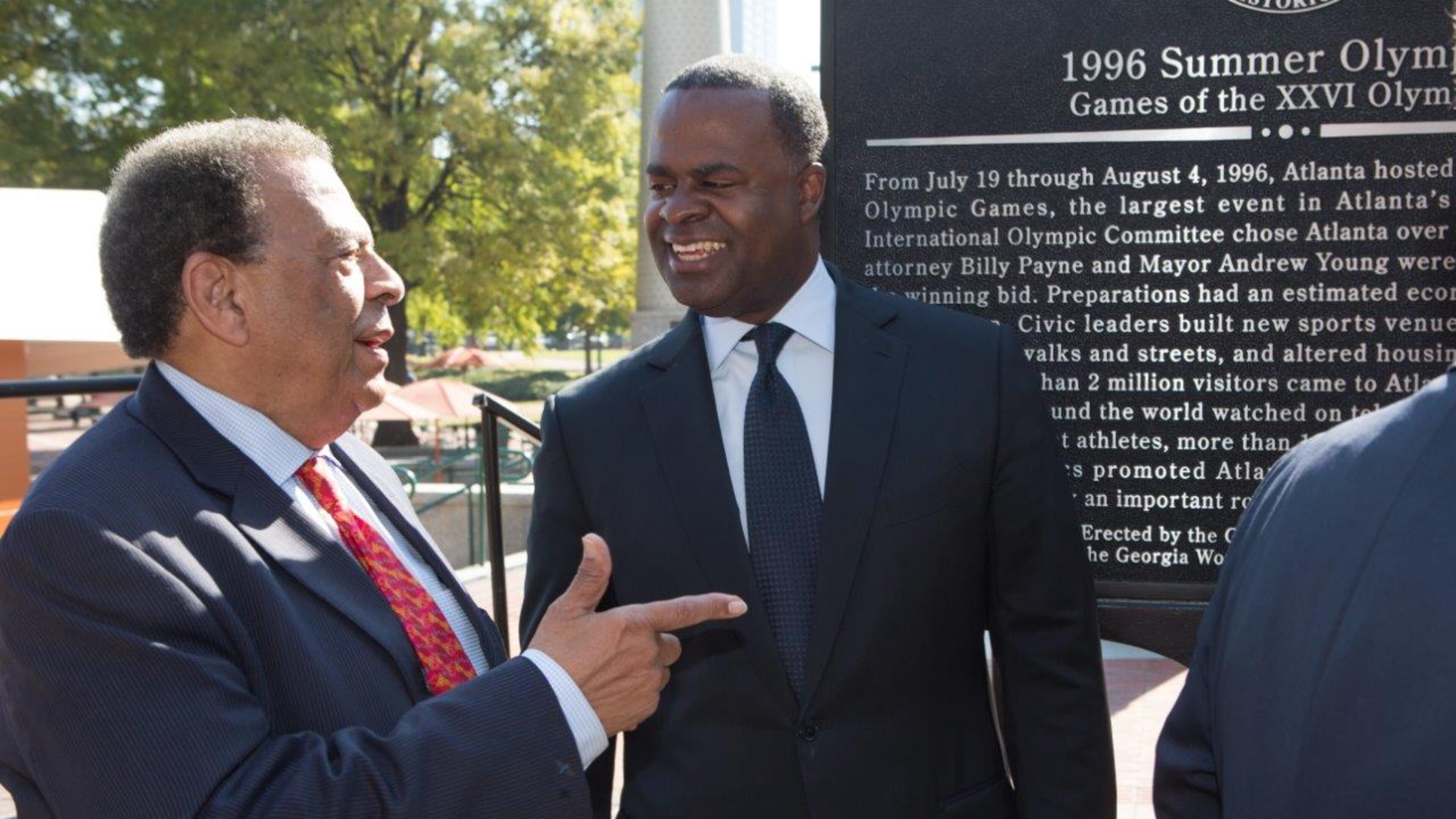 Ambassador Andrew Young and Mayor Kasim Reed chat after the dedication of a Georgia Historical Marker to the 1996 Summer Olympic Games in Centennial Olympic Park in Atlanta on Tuesday November 1st 2016. An effort of the Georgia Historical Society, the dedication took place as the organization inducts the Georgia World Congress Center Authority as an honoree in its Georgia Business History Initiative. AJC FILE PHOTO