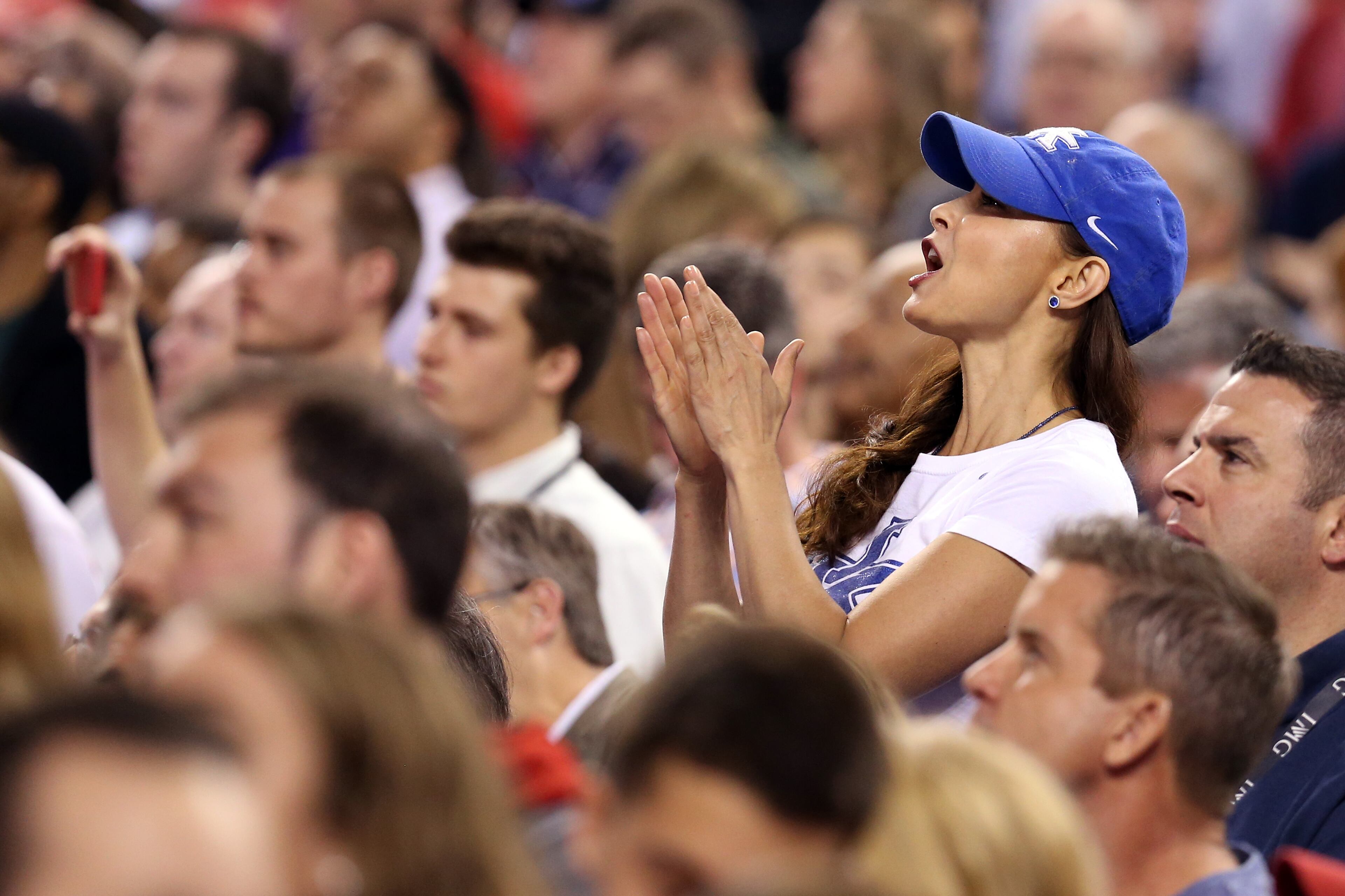 INDIANAPOLIS, IN - APRIL 04: Actress Ashley Judd cheers at the start of the game between the Kentucky Wildcats and the Wisconsin Badgers during the NCAA Men's Final Four Semifinal at Lucas Oil Stadium on April 4, 2015 in Indianapolis, Indiana. (Photo by Streeter Lecka/Getty Images)