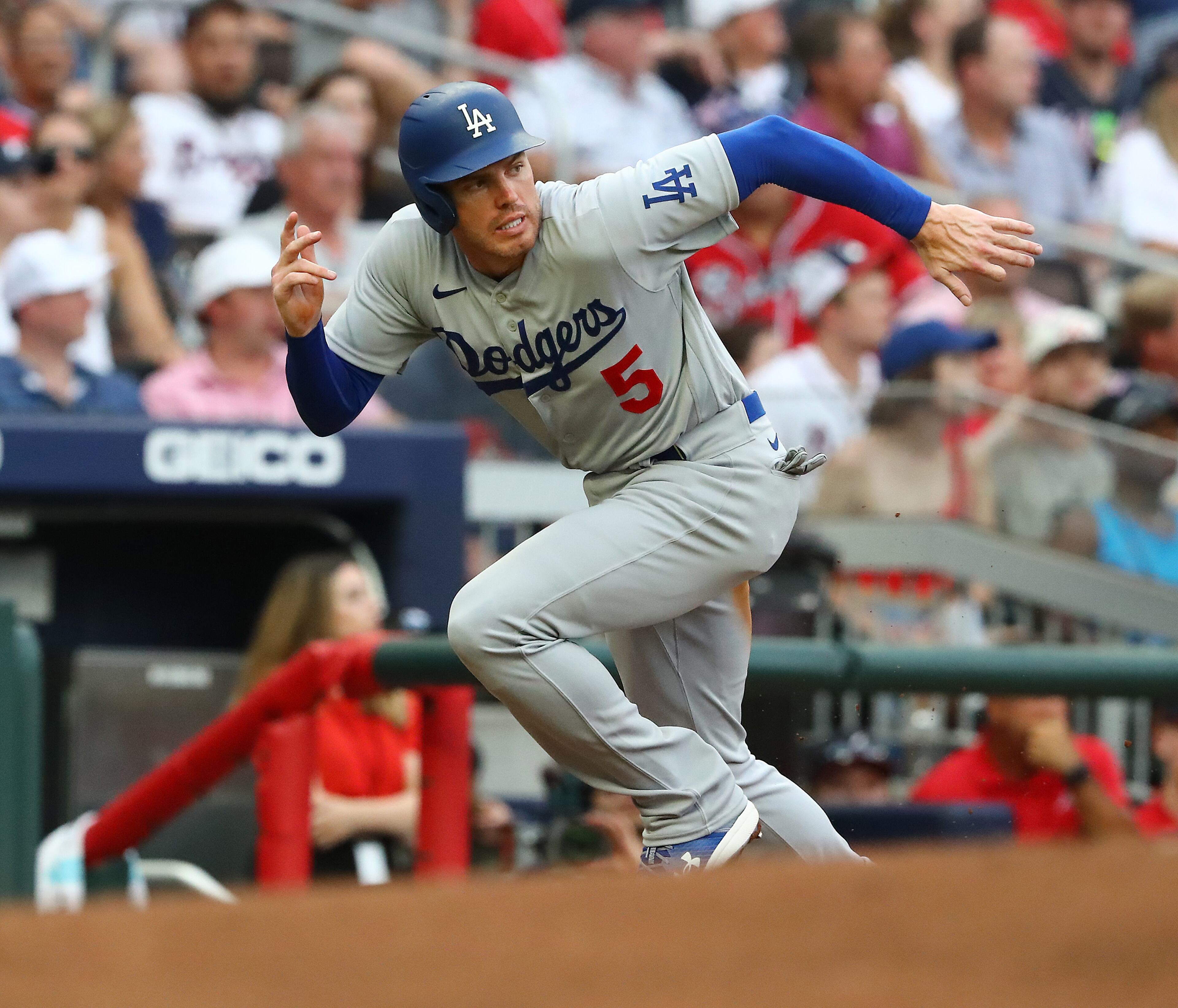 062422 Atlanta: After drawing a walk Los Angles Dodgers Freddie Freeman scores a run from third base on a sacrafice fly by Justin Turner for a 2-0 lead over the Atlanta Braves during the first inning a MLB baseball game on Friday, June 24, 2022, in Atlanta. The series marks Freeman’s first games in Atlanta since the longtime Braves star signed with the Dodgers as a free agent in March. “Curtis Compton / Curtis.Compton@ajc.com”