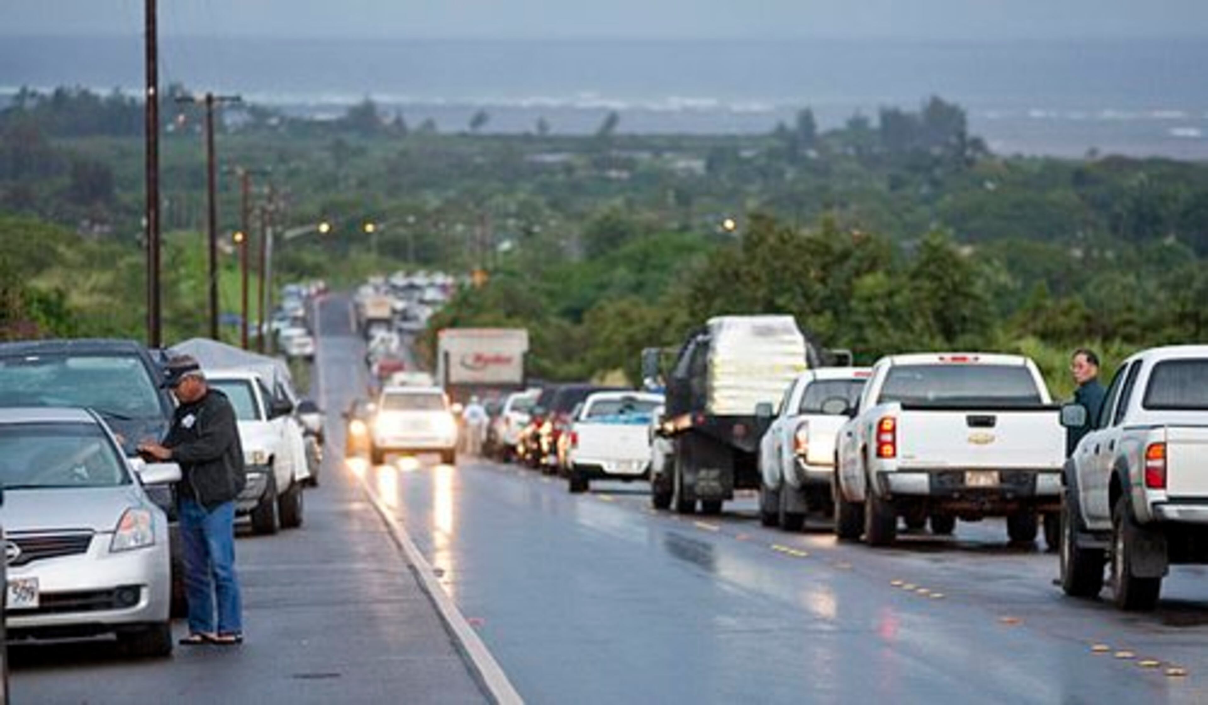Due to a tsunami warning, hundreds of cars line Kamehameha Highway leading into the town of Haleiwa, Hawaii, as residents of the north shore community wait for the all clear to return home Friday, March 11, 2011 in Honolulu. An 8.9-magnitude earthquake struck Japan and sent a tsunami wave across the Pacific.