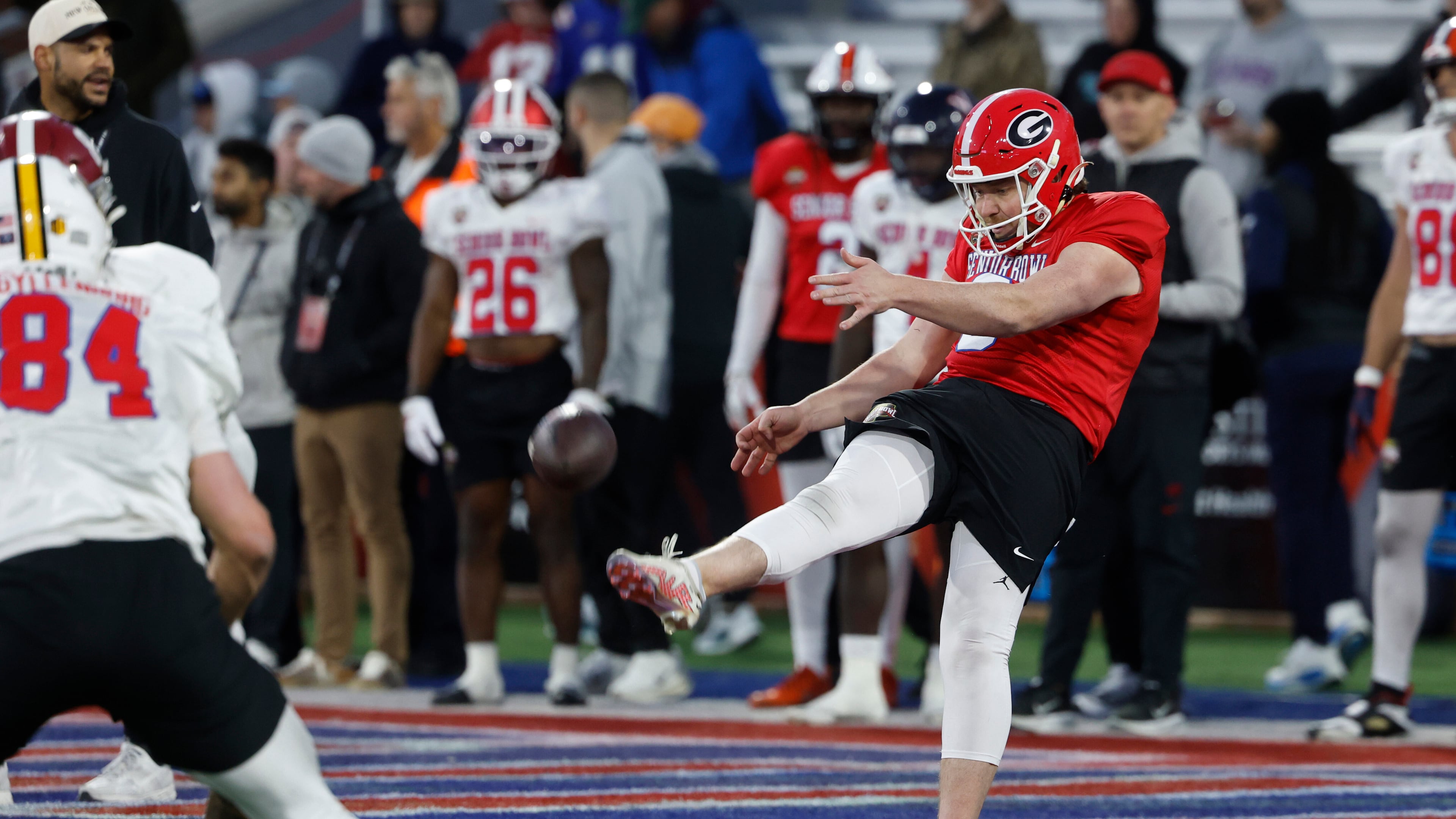 American team punter Brett Thorson (right) runs through drills during practice for the Senior Bowl on Tuesday, Jan. 27, 2026, in Mobile, Ala. Thorson is a former Georgia standout. (Butch Dill/AP)
