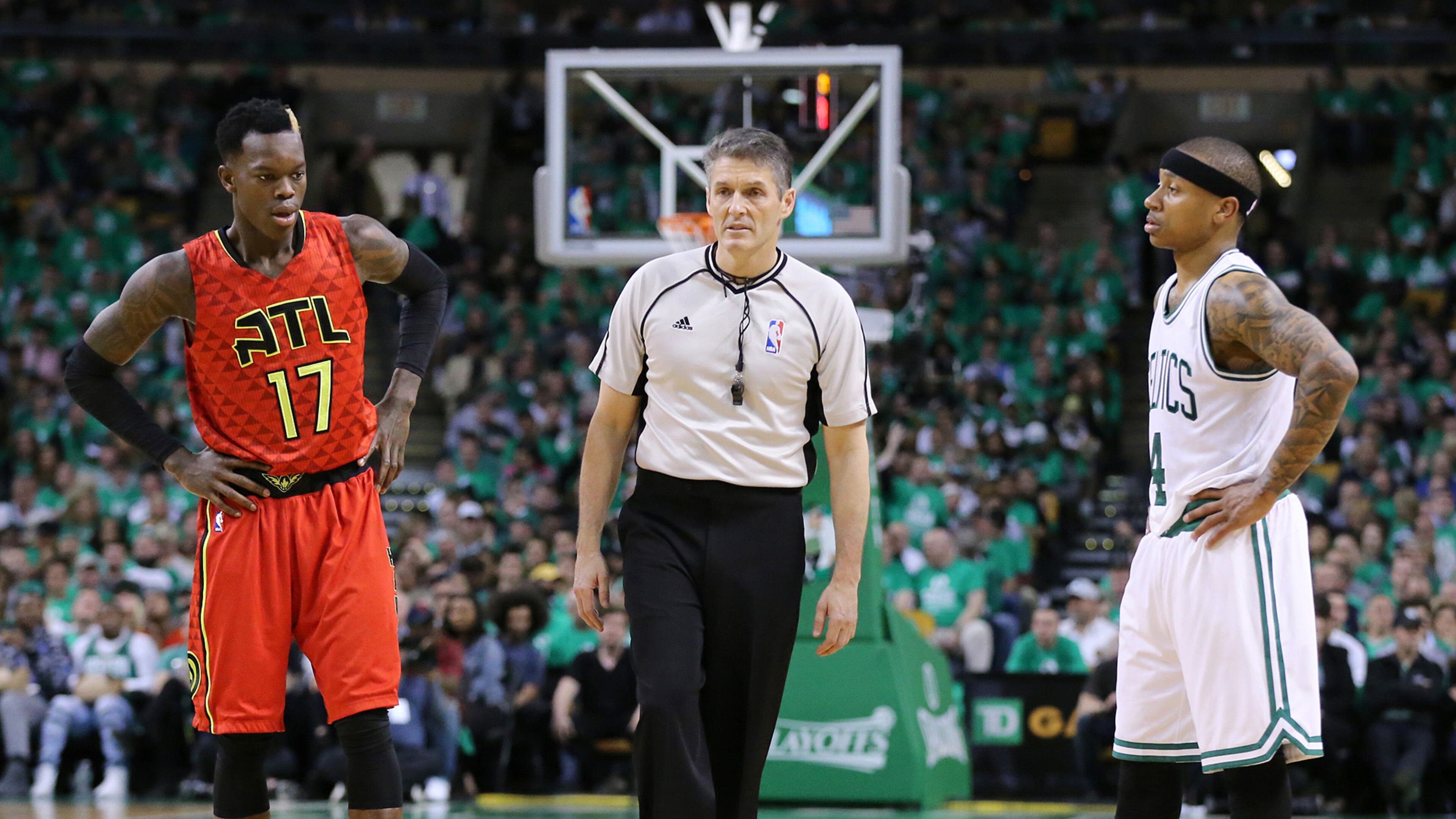 An official stands between Hawks guard Dennis Schroder and Boston guard Isaiah Thomas during last year's playoff series between the two teams. (Curtis Compton / ccompton@ajc.com)
