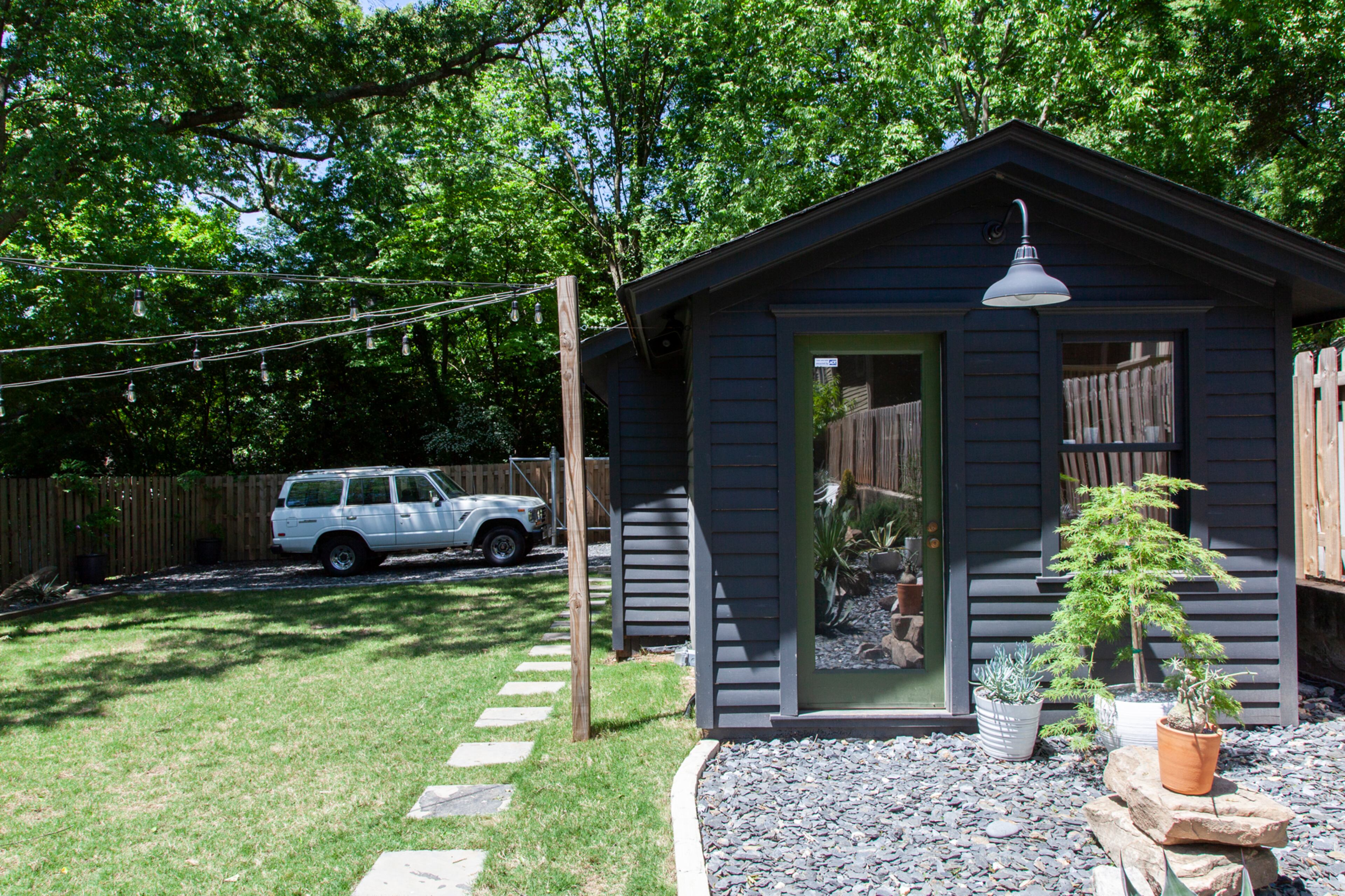 The backyard also has homeowner Derek Fandel's hobby furniture shop, which uses one of the walls from an original 1911 building on the property. The homeowners said they had to remove an 8-foot mound of weeds, and the parking pad previously was a hill with old fireplace tile and other construction debris.