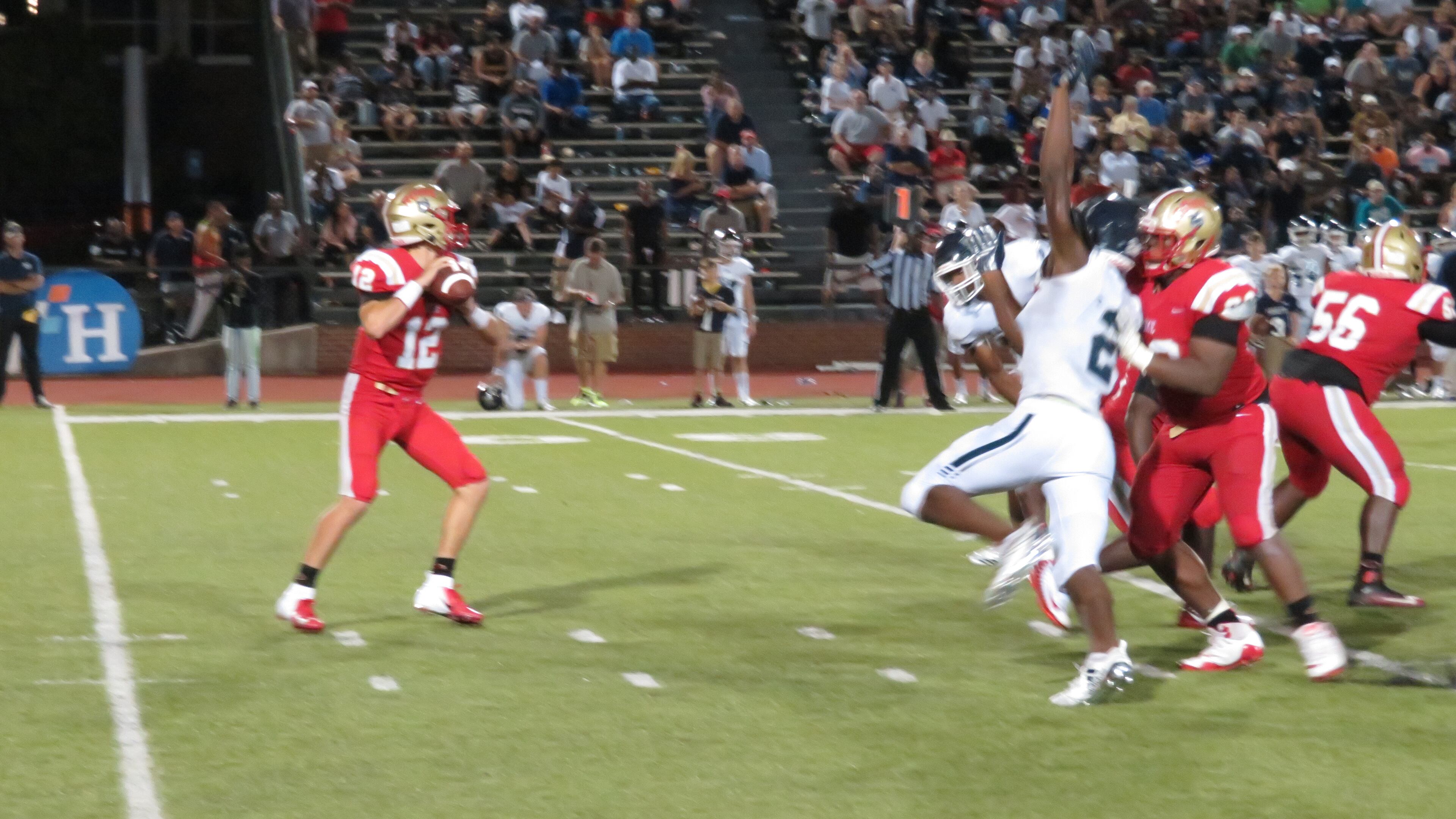 Rome Wolves quarterback Knox Kadum (12) stands in the pocket in their game against the Marietta Blue Devils on Thursday, Aug. 16, 2018 at Barron Stadium in Rome, Ga., in the 27th annual Corky Kell Classic. (Adam Krohn/special)
