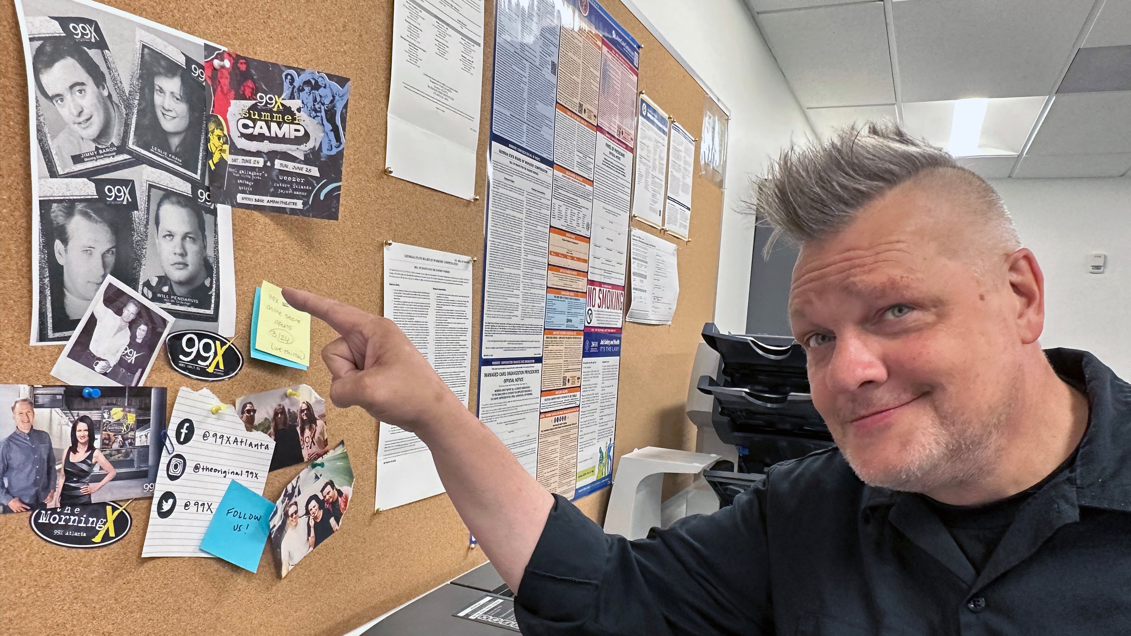 Will Pendarvis found some old 99X promo photos from back in the day and hung them up in the Cumulus break room, including a shot of his much younger self from three decade ago. RODNEY HO/rho@ajc.com