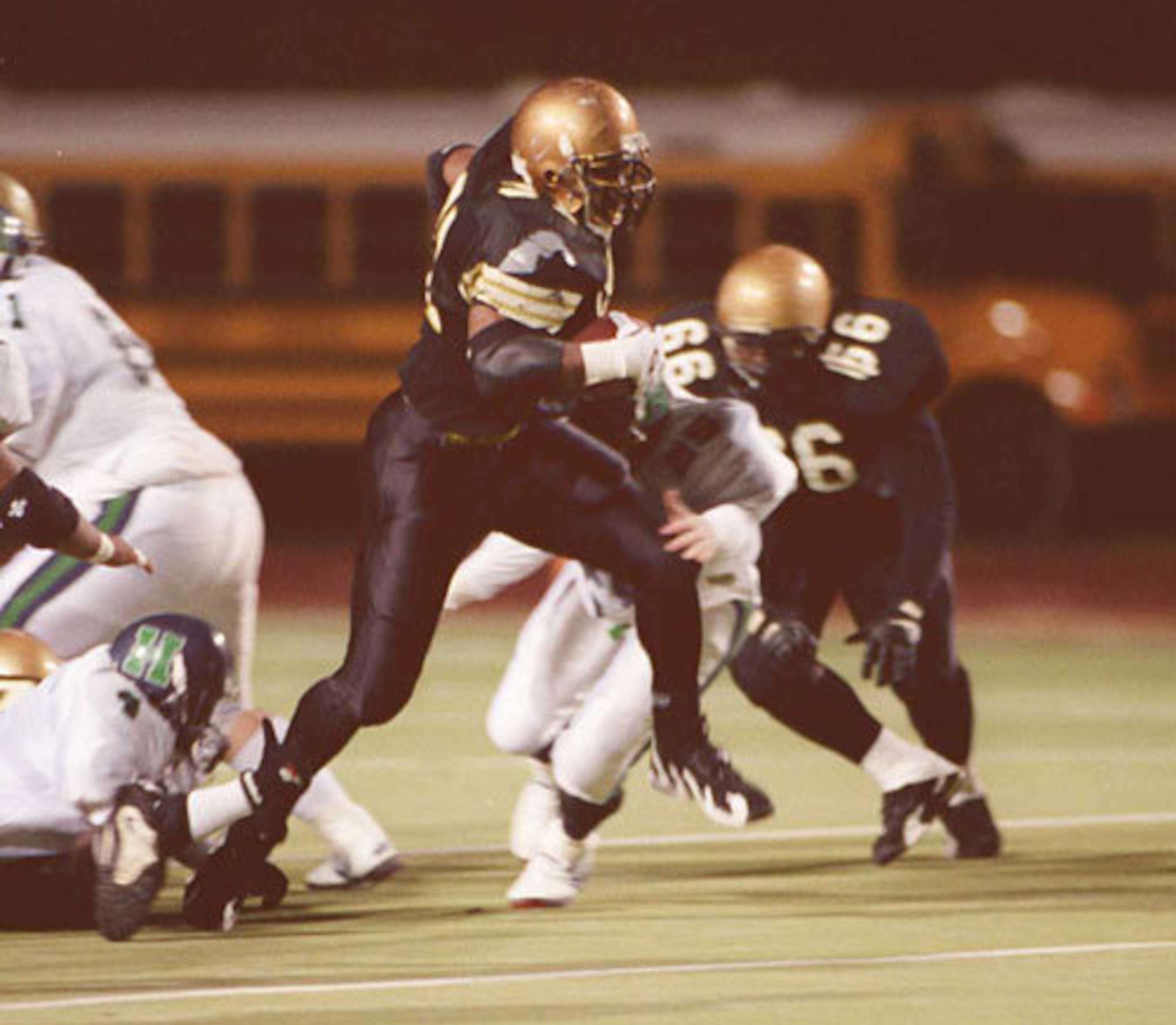 At Douglass, Lewis (31, center) rushed for a school-record 4,879 yards and 68 TDs -- a record later broken by Browns teammate and fellow Douglass alum James Davis.