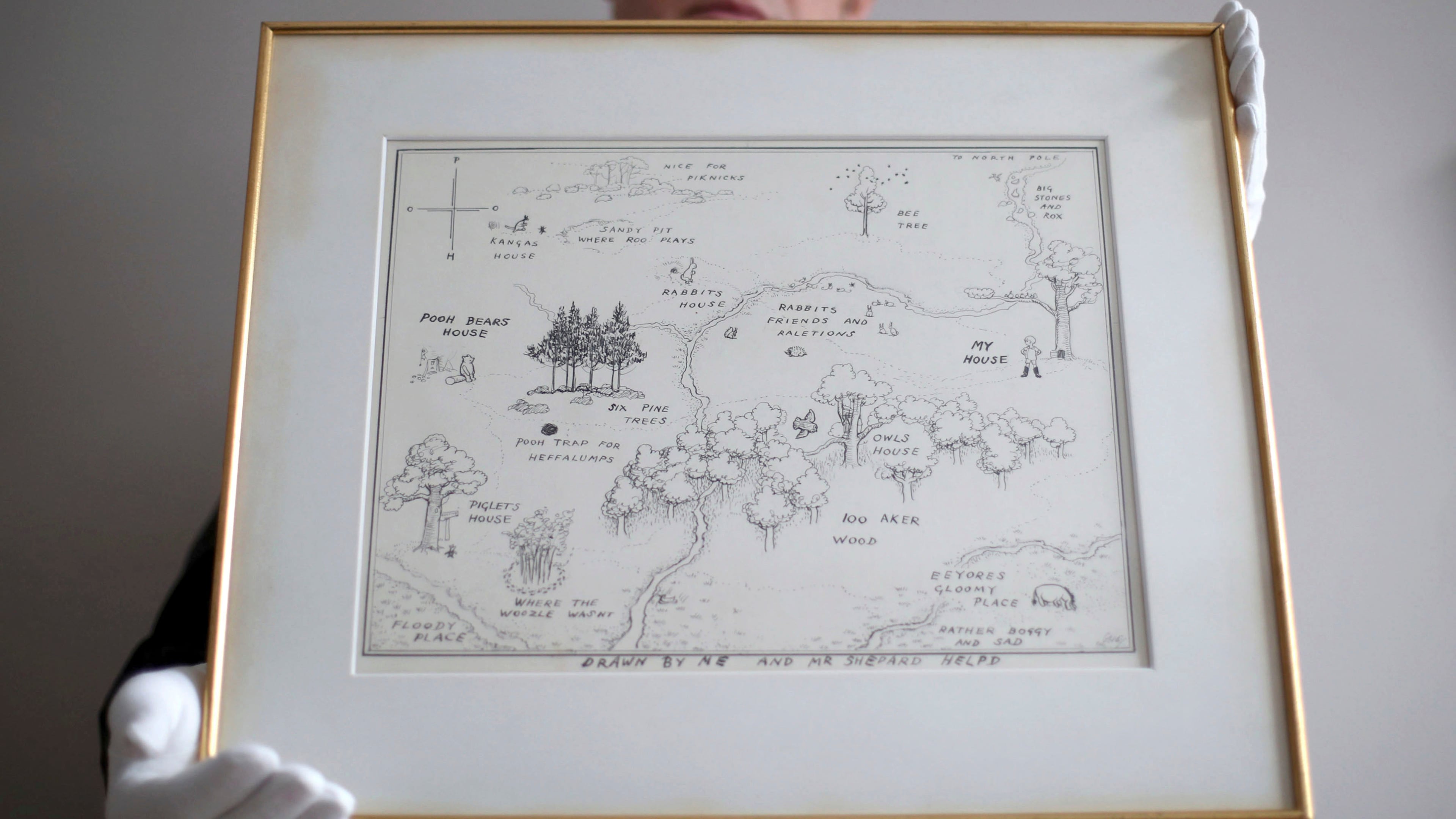 In this photo dated May 31, 2018, Philip W. Errington holds the original map of Winnie-the-Pooh's Hundred Acre Wood by E H Shepard.