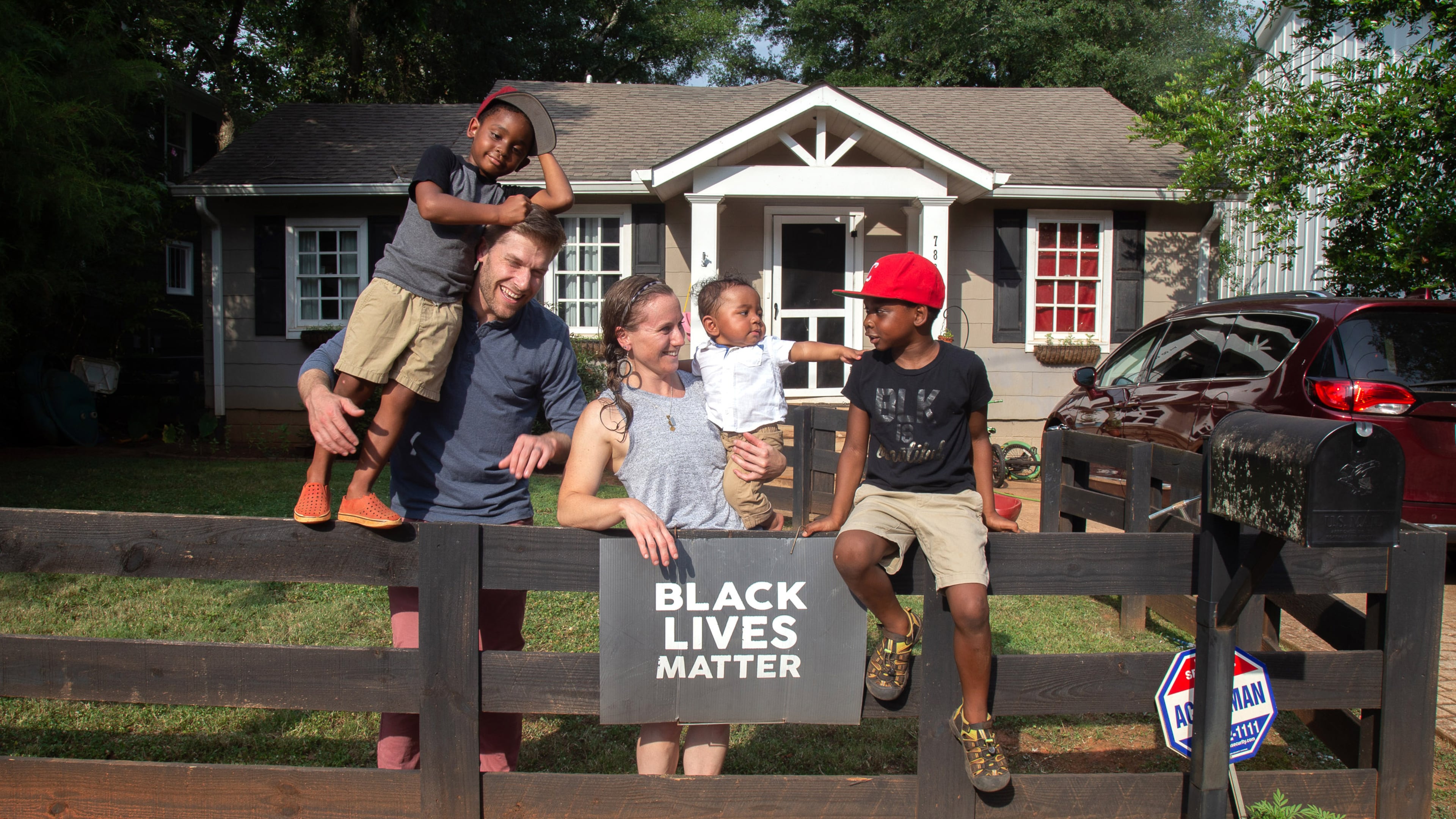 Zach and Brit Eyster and their three children - Mac (standing on fence); Cyrus (baby) and Clark (red hat) - pose for a photograph in front of their Decatur on home July 15, 2020.
STEVE SCHAEFER FOR THE ATLANTA JOURNAL-CONSTITUTION