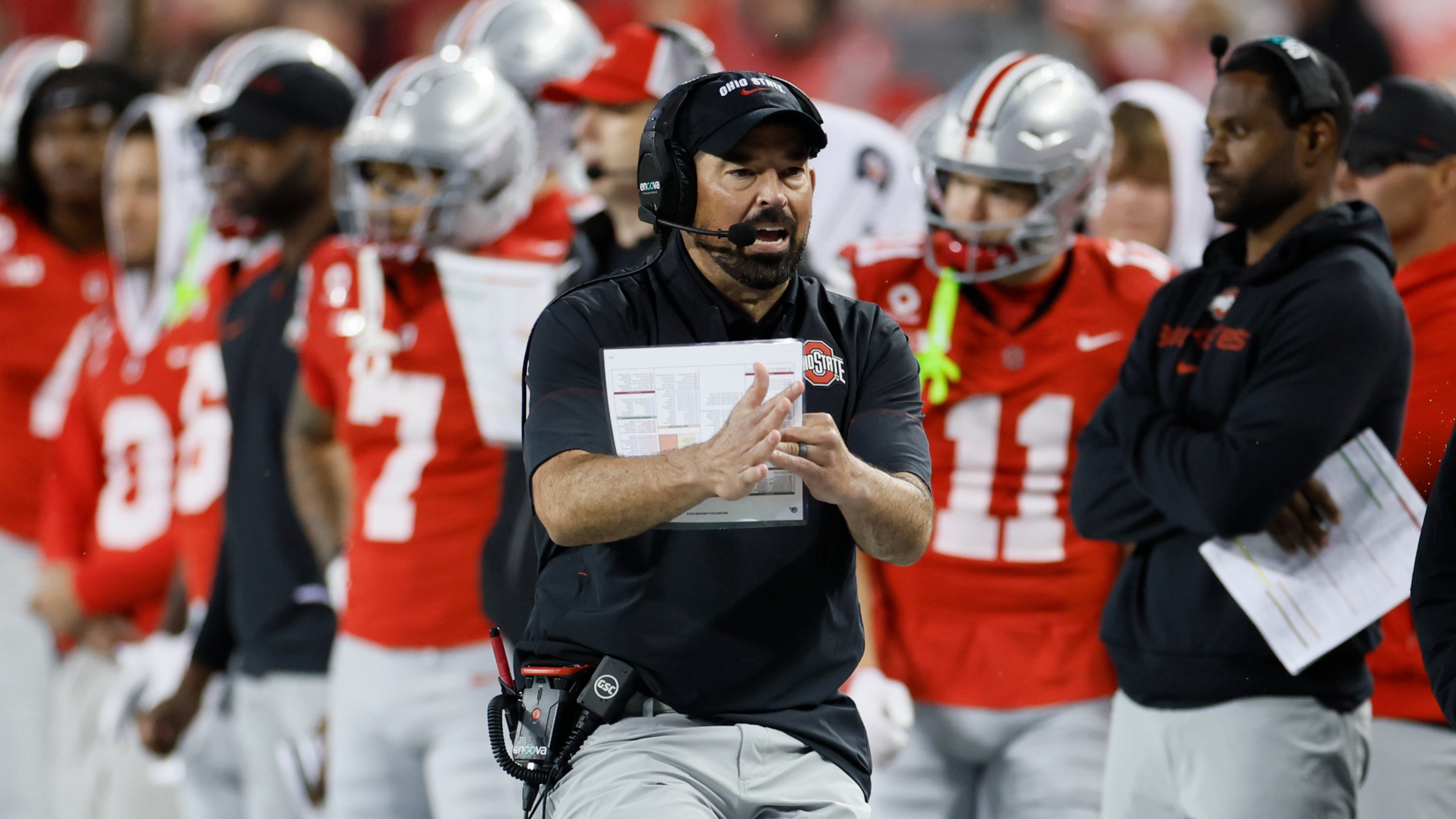 Ohio State head coach Ryan Day, center, calls for a timeout during the second half of an NCAA college football game against Maryland, Saturday, Oct. 10, 2026, in Columbus, Ohio. (AP Photo/Jay LaPrete)