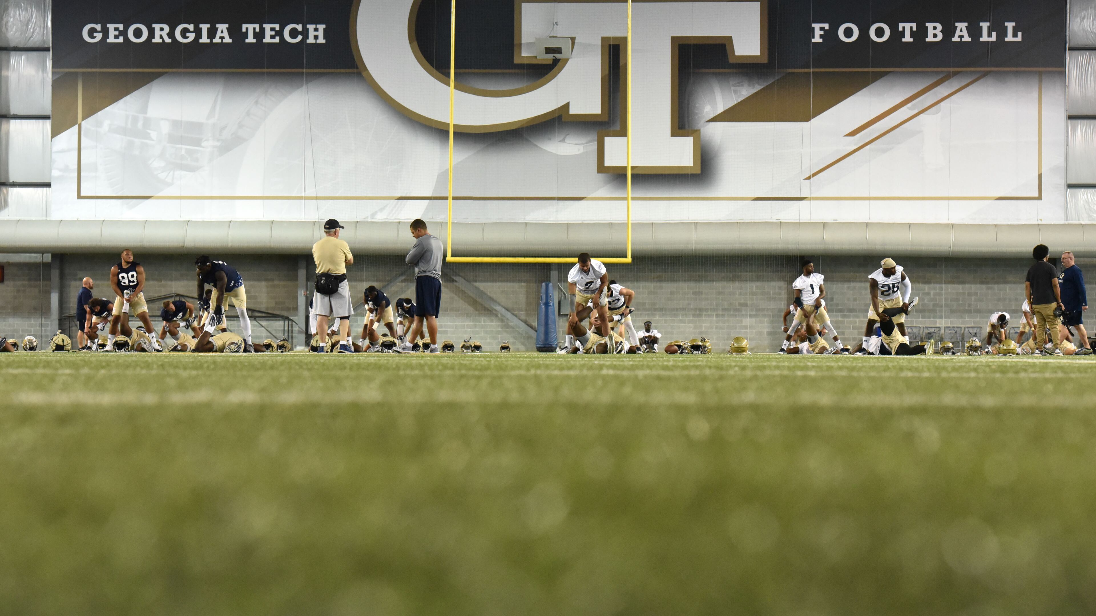 Georgia Tech players warm up during the first day of Tech football practice at Rose Bowl Field on Friday, August 4, 2017. HYOSUB SHIN / HSHIN@AJC.COM