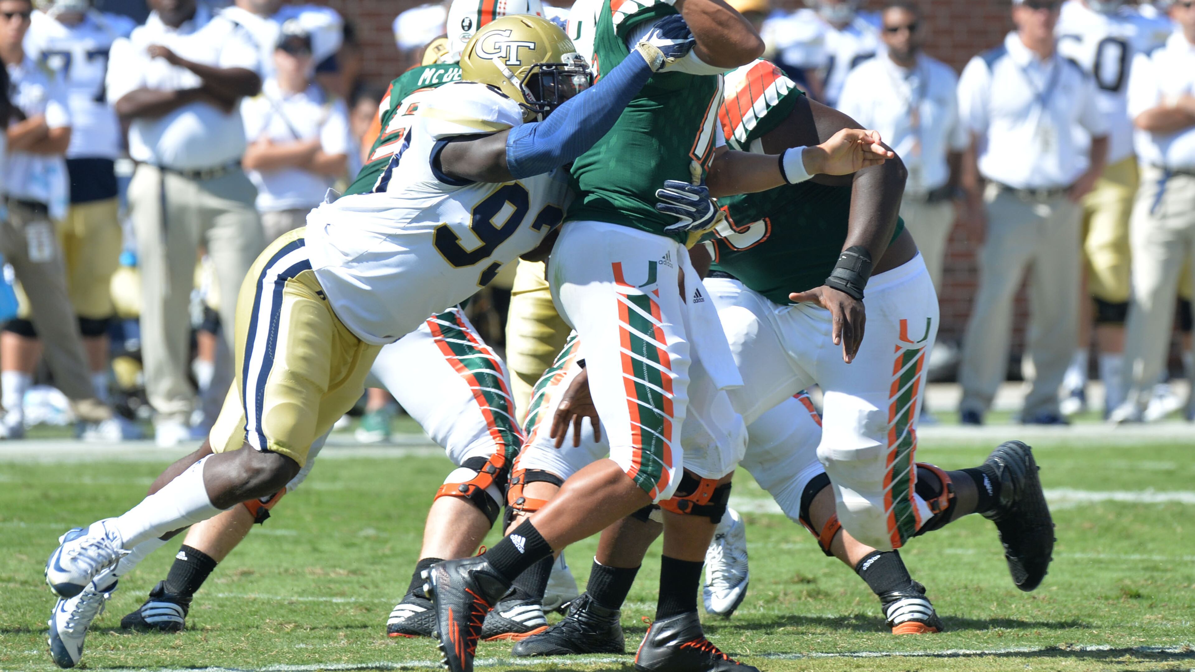 Miami Hurricanes quarterback Brad Kaaya (15) can’t get this pass off as Georgia Tech defensive lineman Antonio Simmons (93) brings him down in the second half at Bobby Dodd Stadium on Saturday, October 1, 2016. Miami won 35-21 over the Yellow Jackets. HYOSUB SHIN / HSHIN@AJC.COM