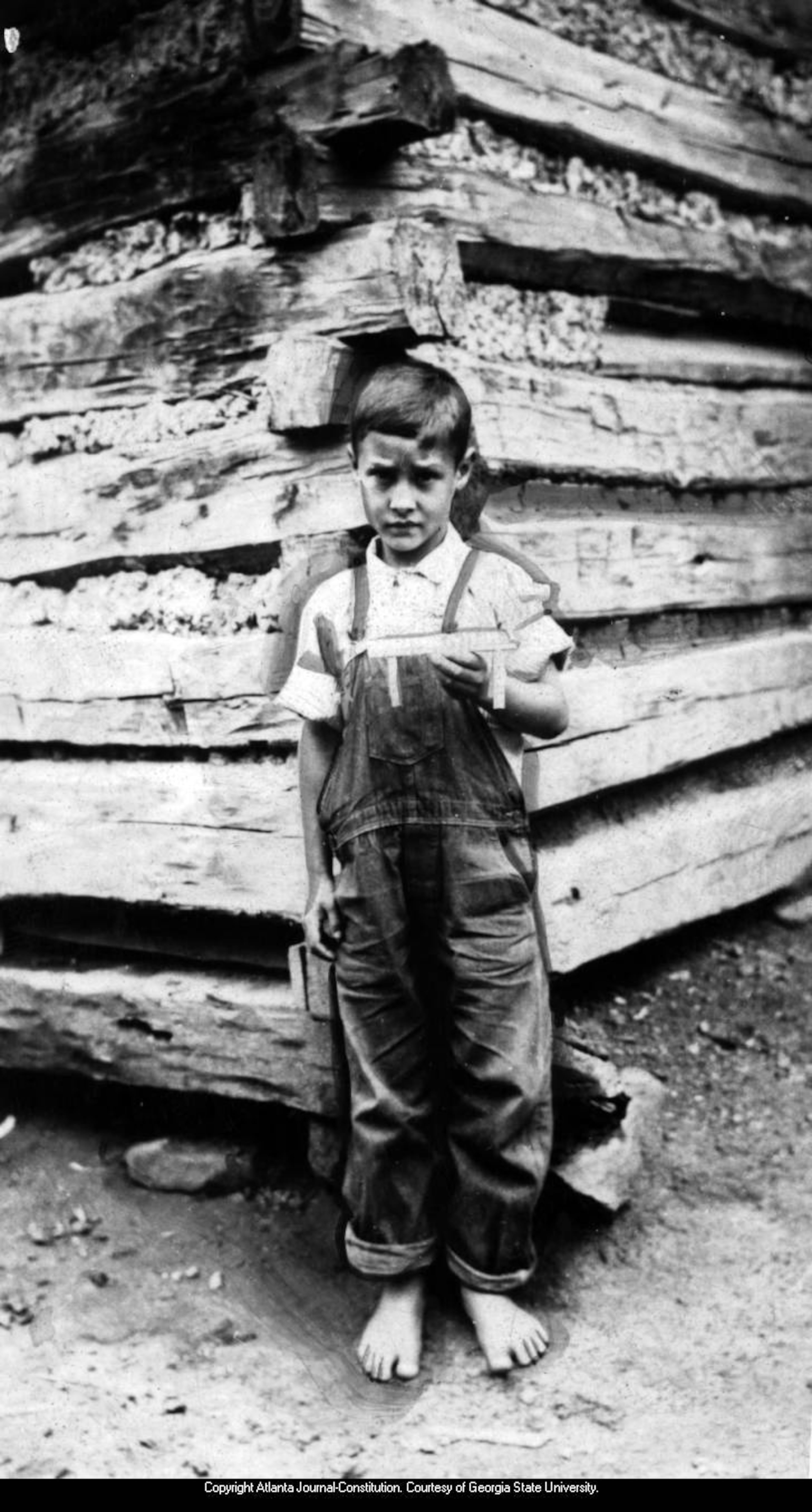 Dec. 25, 1938 -- Young Paul Wooten is shown holding a toy he whittled. AJC PHOTO ARCHIVES