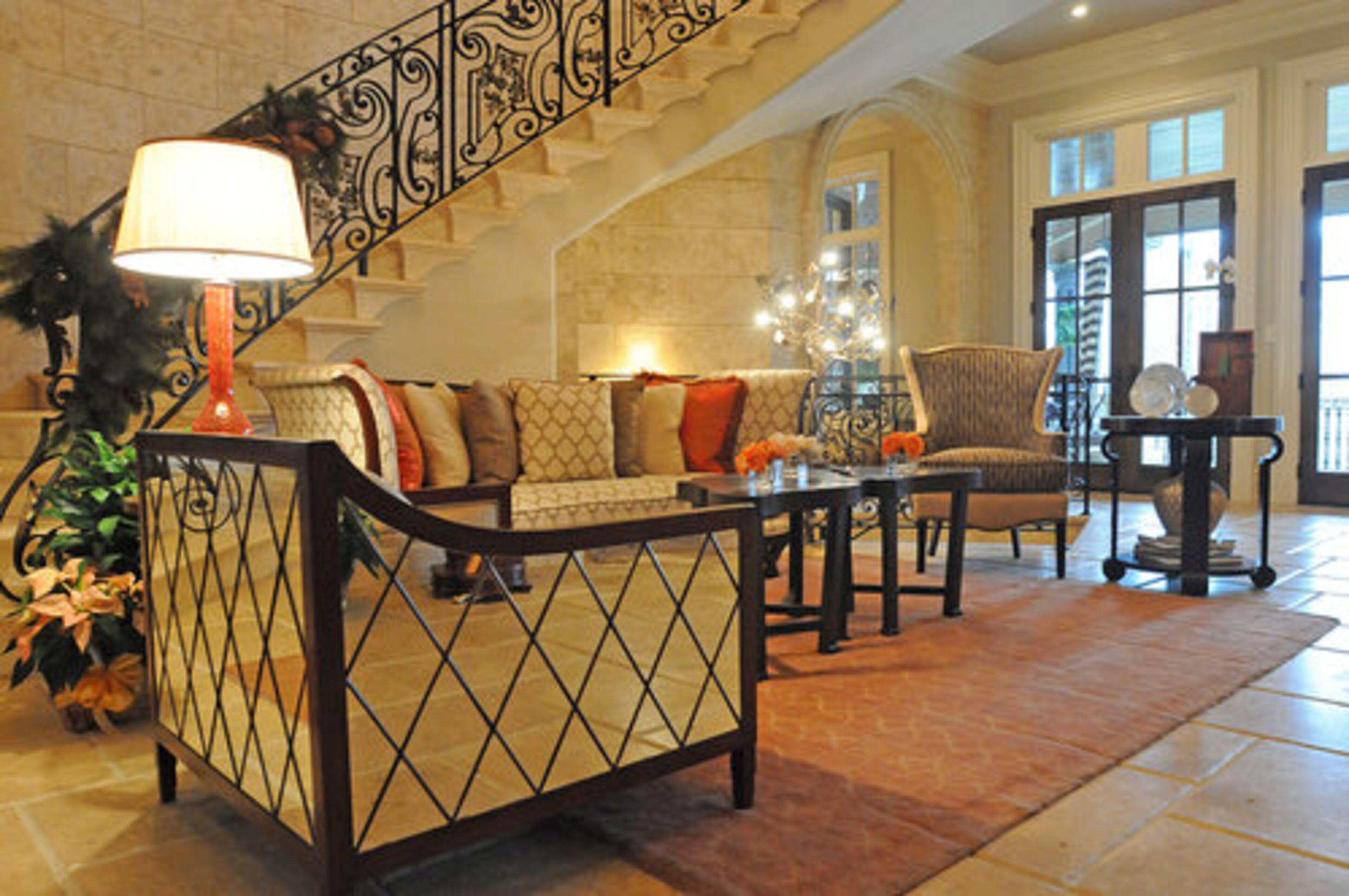 The foyer and grand rotunda were designed by The Interior Motive, based in Roswell. The room combines traditional lines with high design and an edgy flair. One of the room's highlights is the diamond mirrored chair.