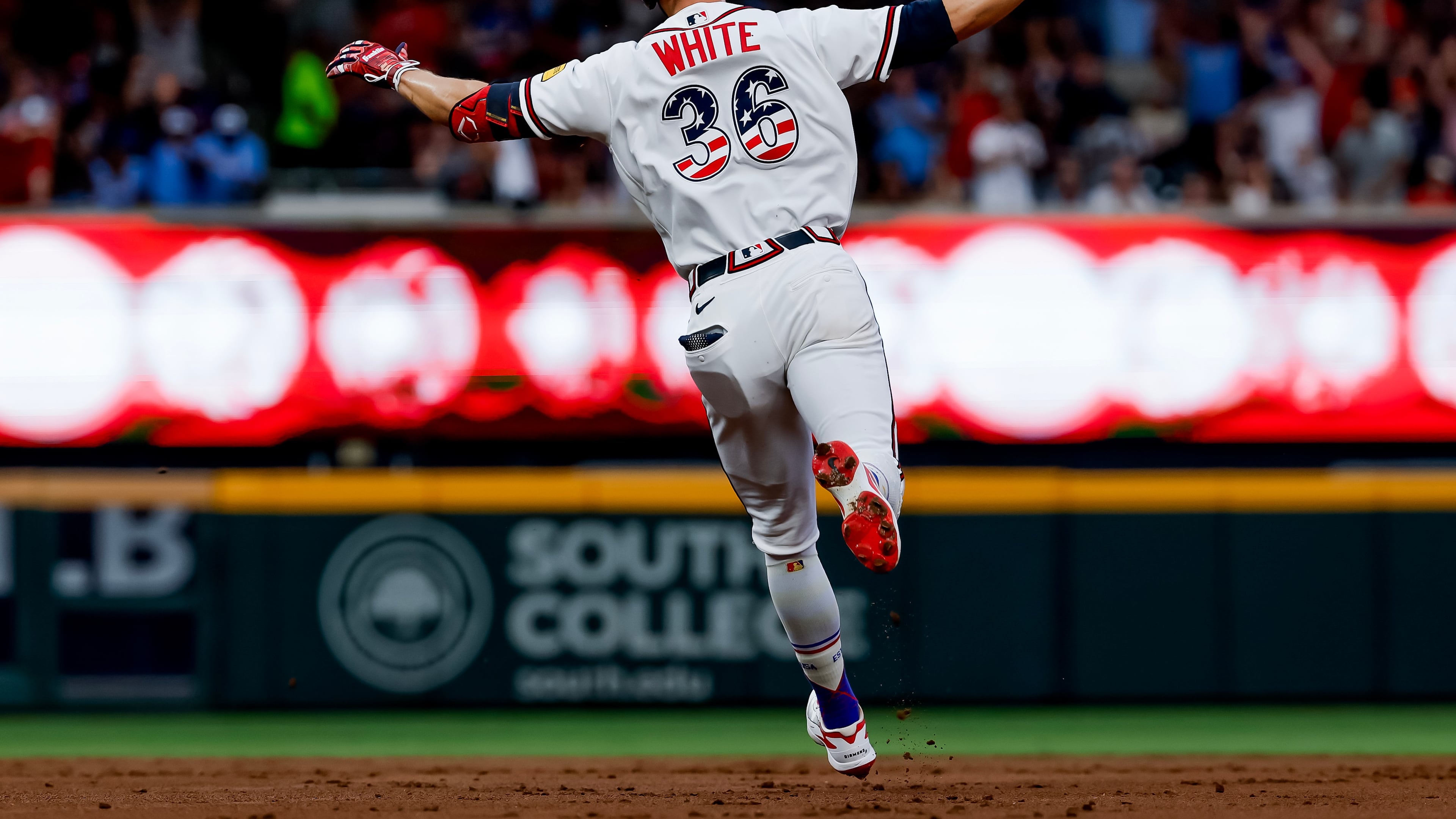 Atlanta Braves' Eli White reacts while rounding the bases after hitting solo home run against the New York Mets during the second inning of a baseball game, Saturday, July 4, 2026, in Atlanta. (AP Photo/Erik S. Lesser)