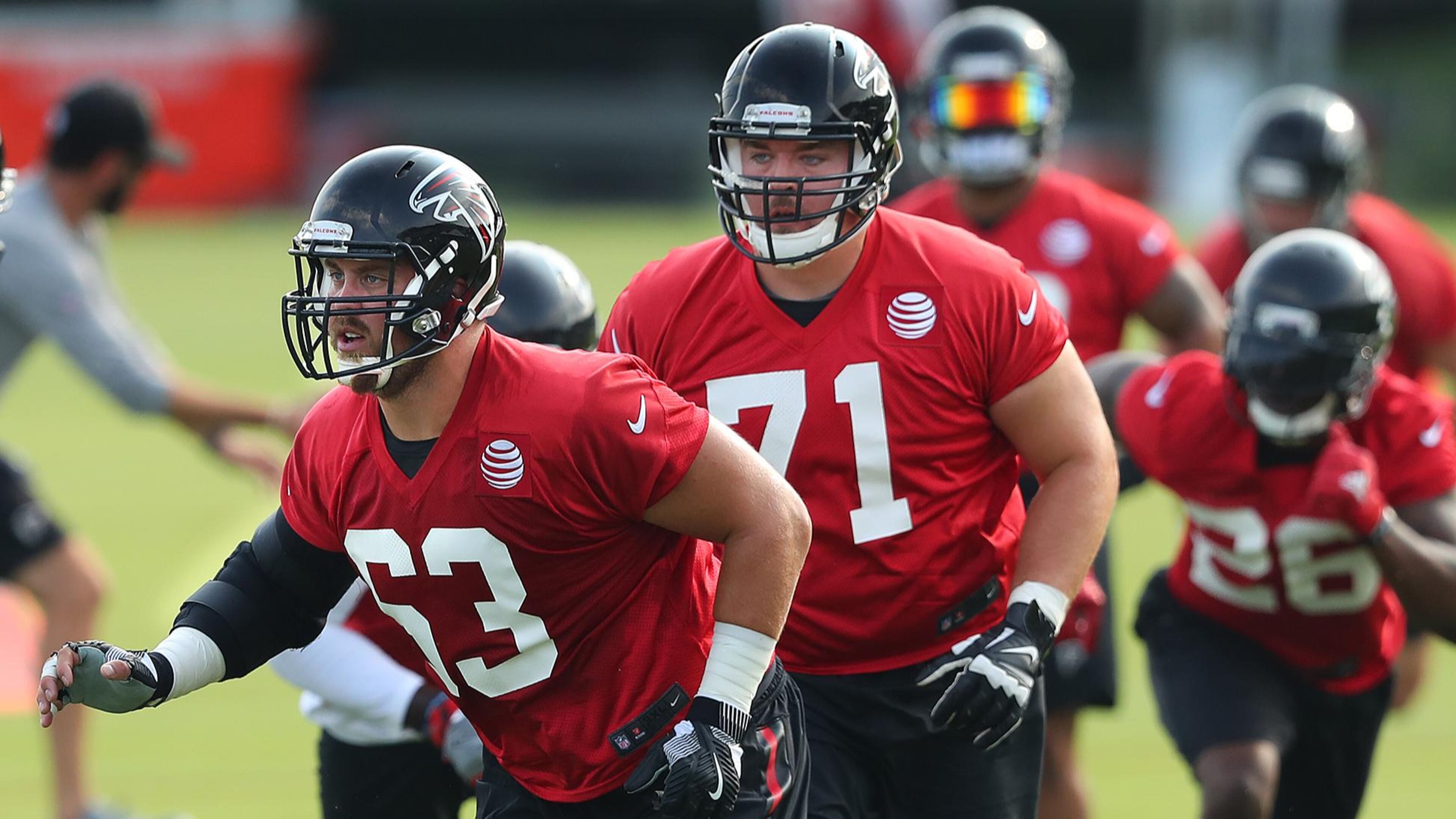 Offensive linemen Ben Garland (63) and Wes Schweitzer (71) battled for the starting right guard position throughout the exhibition season. Curtis Compton/ccompton@ajc.com