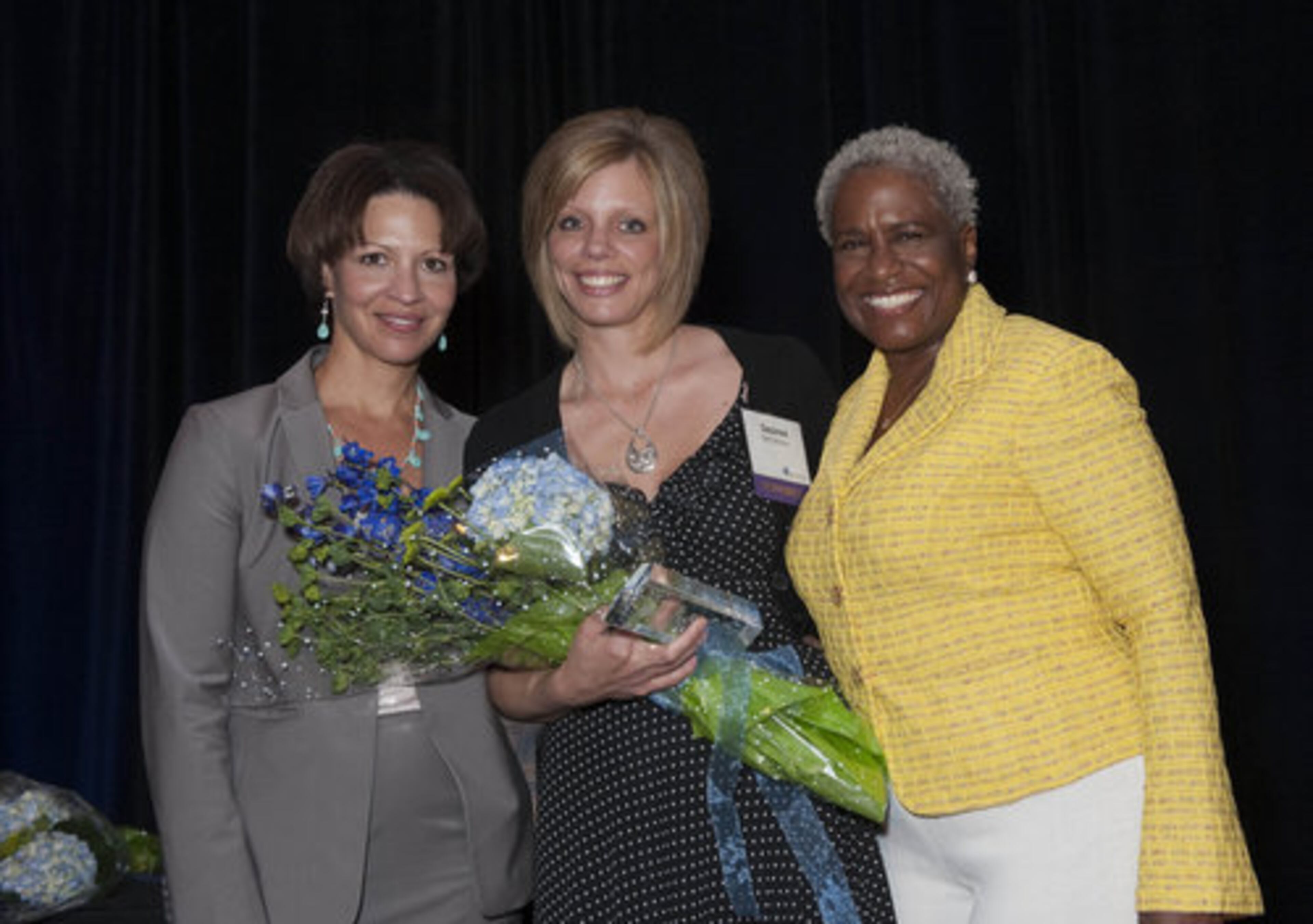 Winner Desiree McClendon (middle) is a nurse at Newton Medical Center in Covington. Congratulating McClendon are WSB-TV news anchor and mistress of ceremonies Monica Pearson (right) and Rose Retter, recruitment sales manager of AJC Jobs.