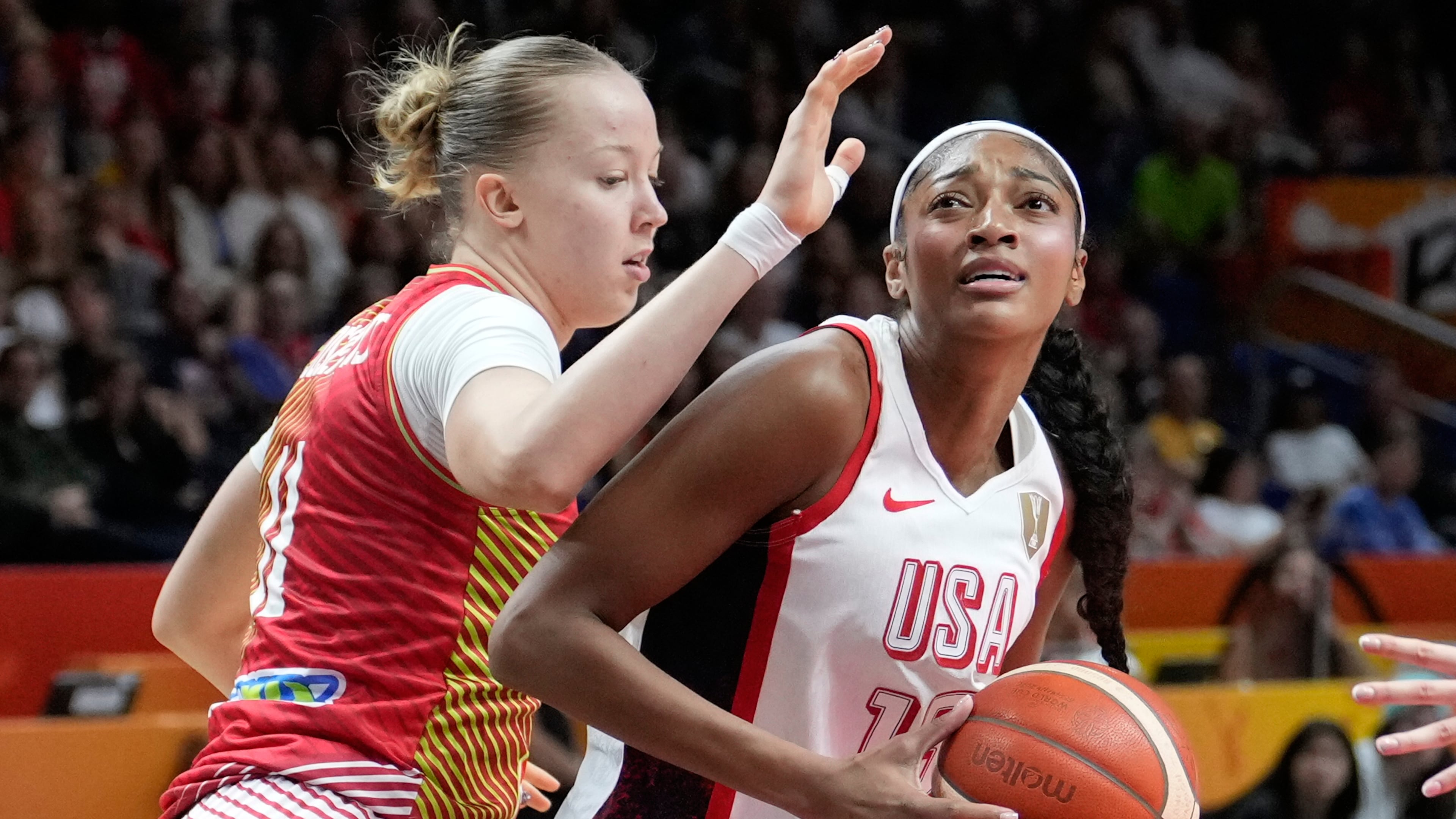 Hungary's Kinga Josepovits guards Angel Reese, of the United States, during the Women's Basketball World Cup quarterfinal match between the United States and Hungary in Berlin, Thursday, Sept. 10, 2026. (AP Photo/Ebrahim Noroozi)