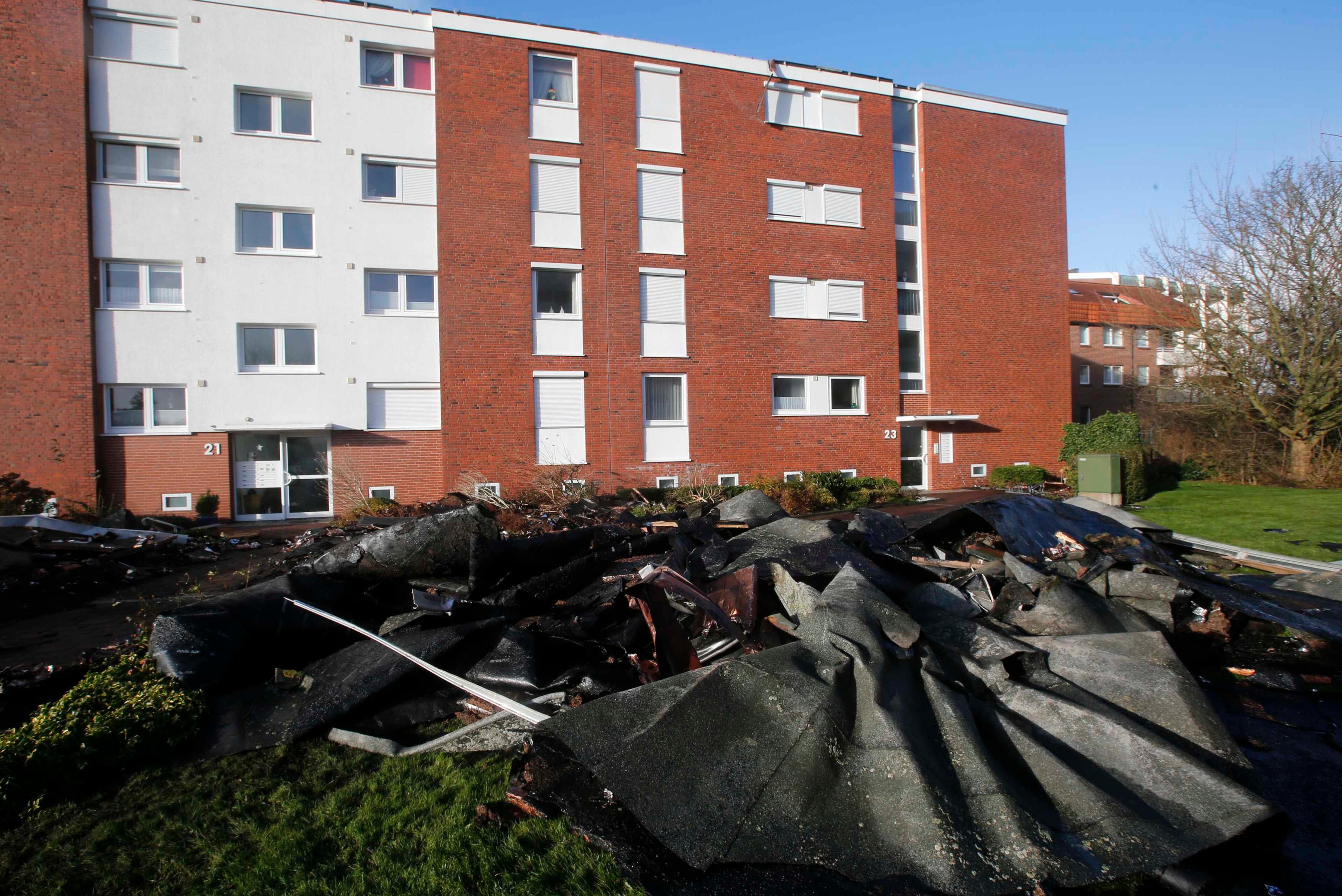 The rooftop of a building blown away by a storm is pictured in the coastal town of Cuxhaven at the North Sea, December 6, 2013. Hurricane-force Storm Xaver blasted towards mainland Europe on Friday after cutting transport and power in northern Britain and killing three people in what meteorologists warned could be the worst storm to hit the continent in years. REUTERS/Fabrizio Bensch